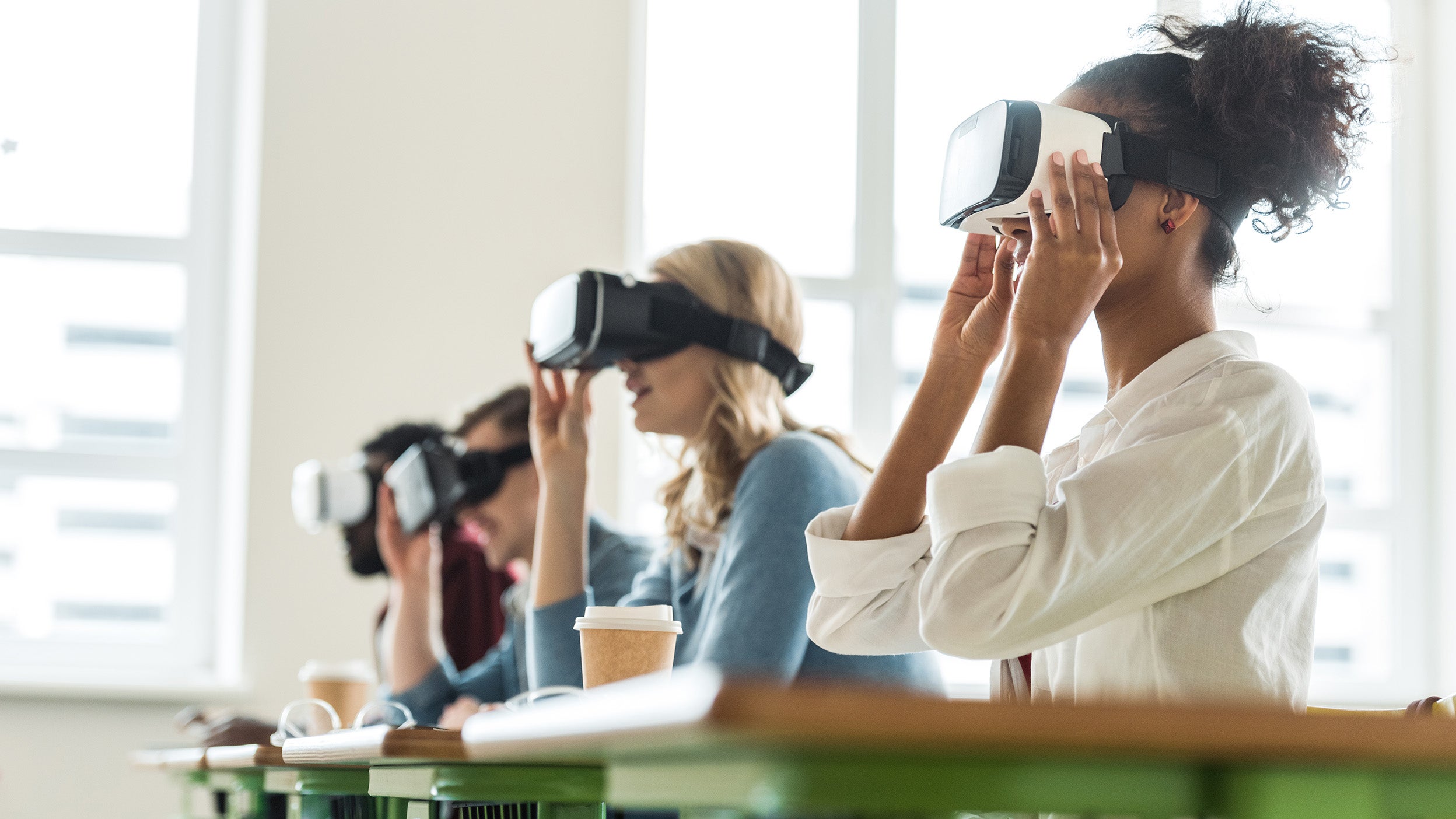 Classroom of people using virtual reality devices