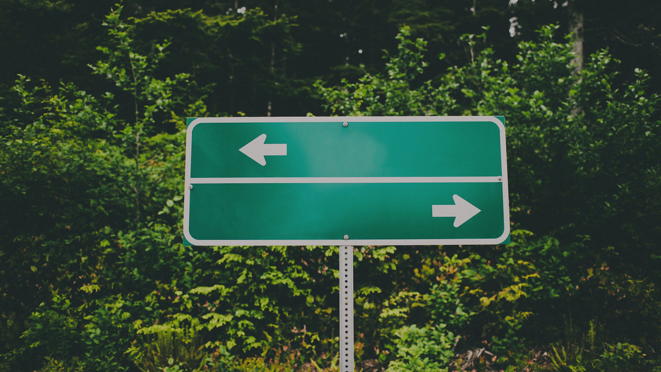 Road sign with left and right arrow 