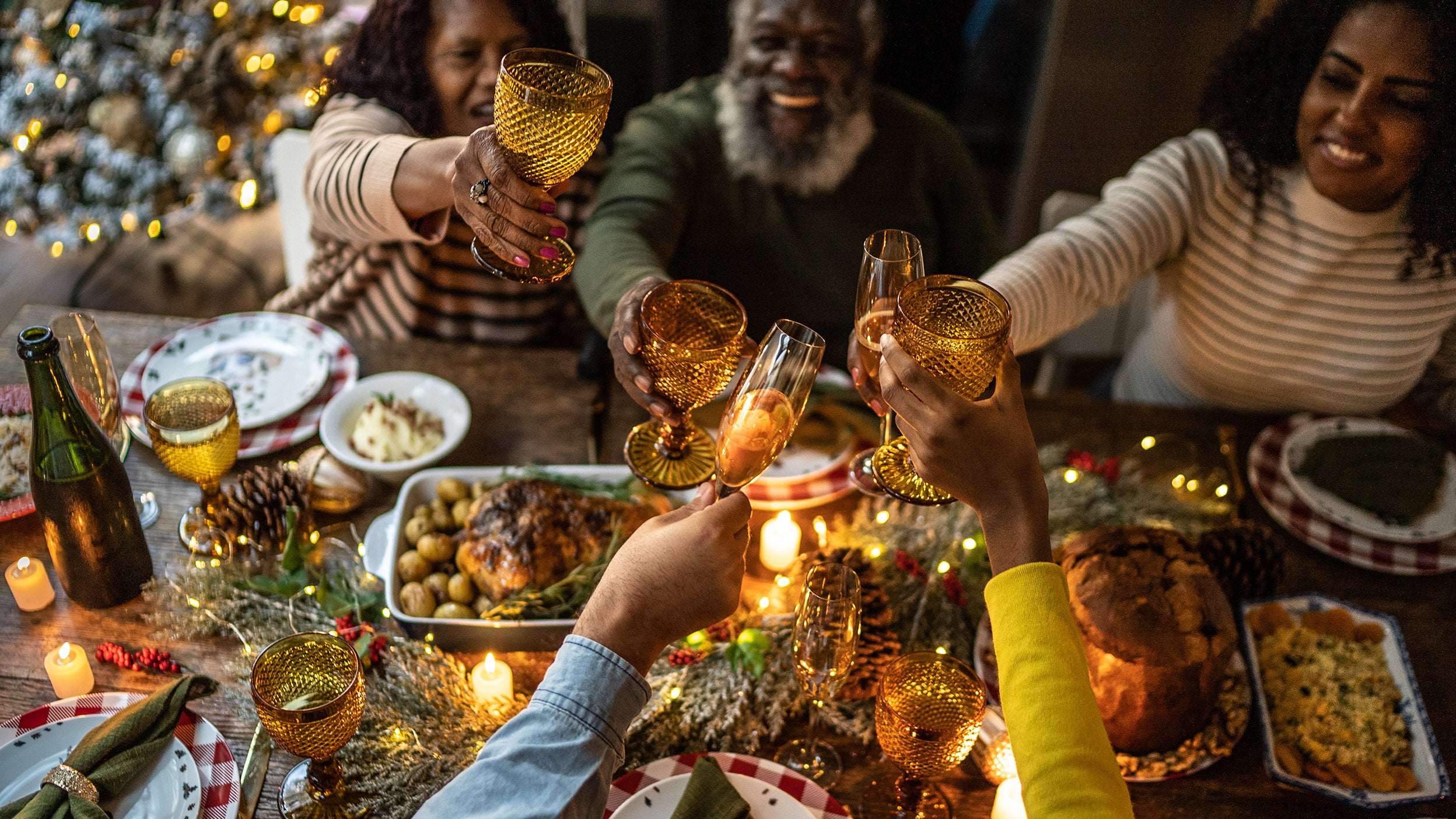 Family toasting at a holiday dinner at home