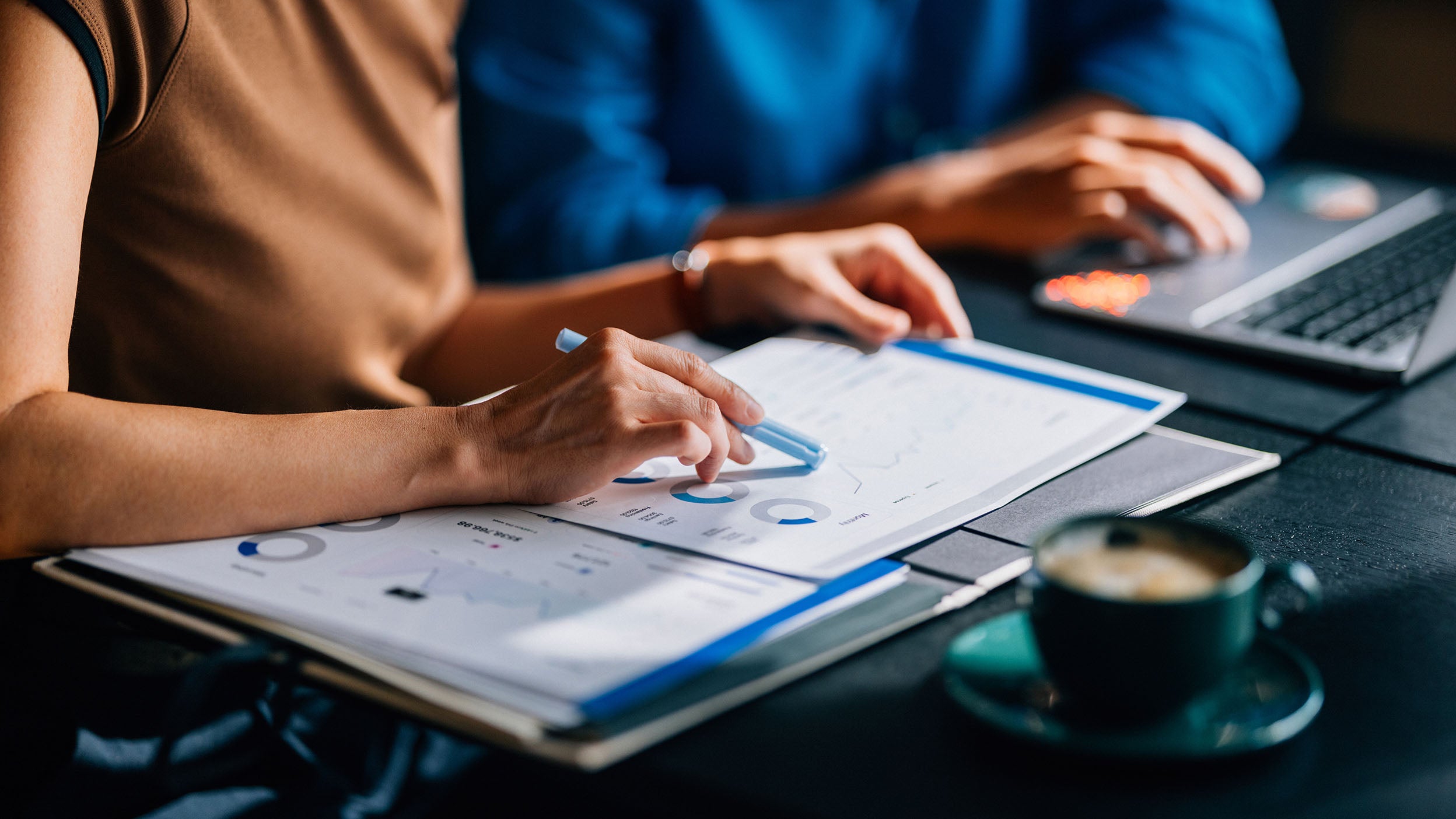 Business Team Analyzing Financial Data in Modern Office