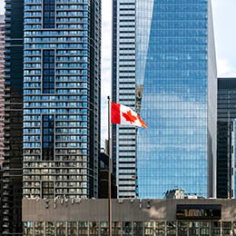 Canadian%20flag%20in%20front%20of%20modern%20skyscrapers