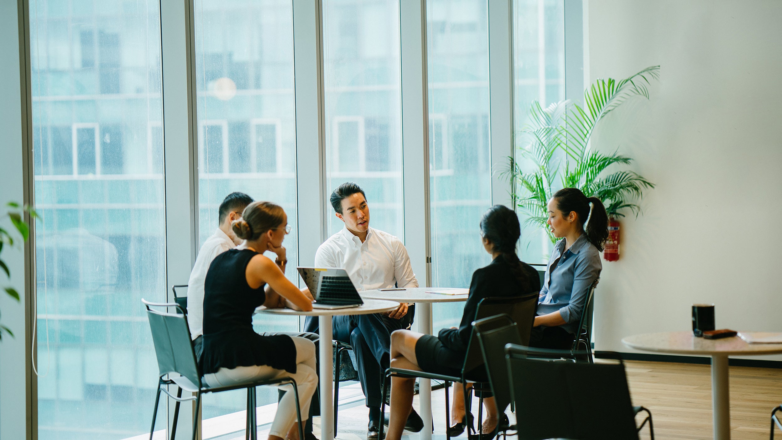 Multi-ethnic group of business persons discussing business