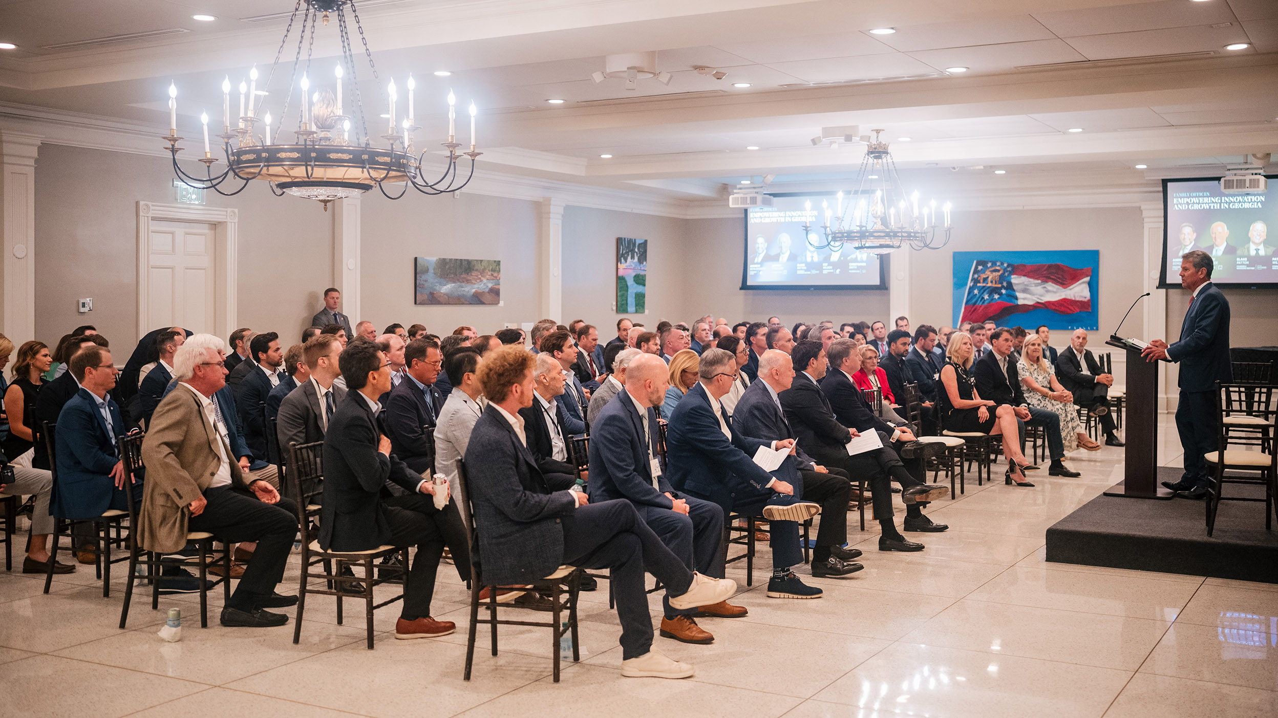 A person giving speach in a meeting hall