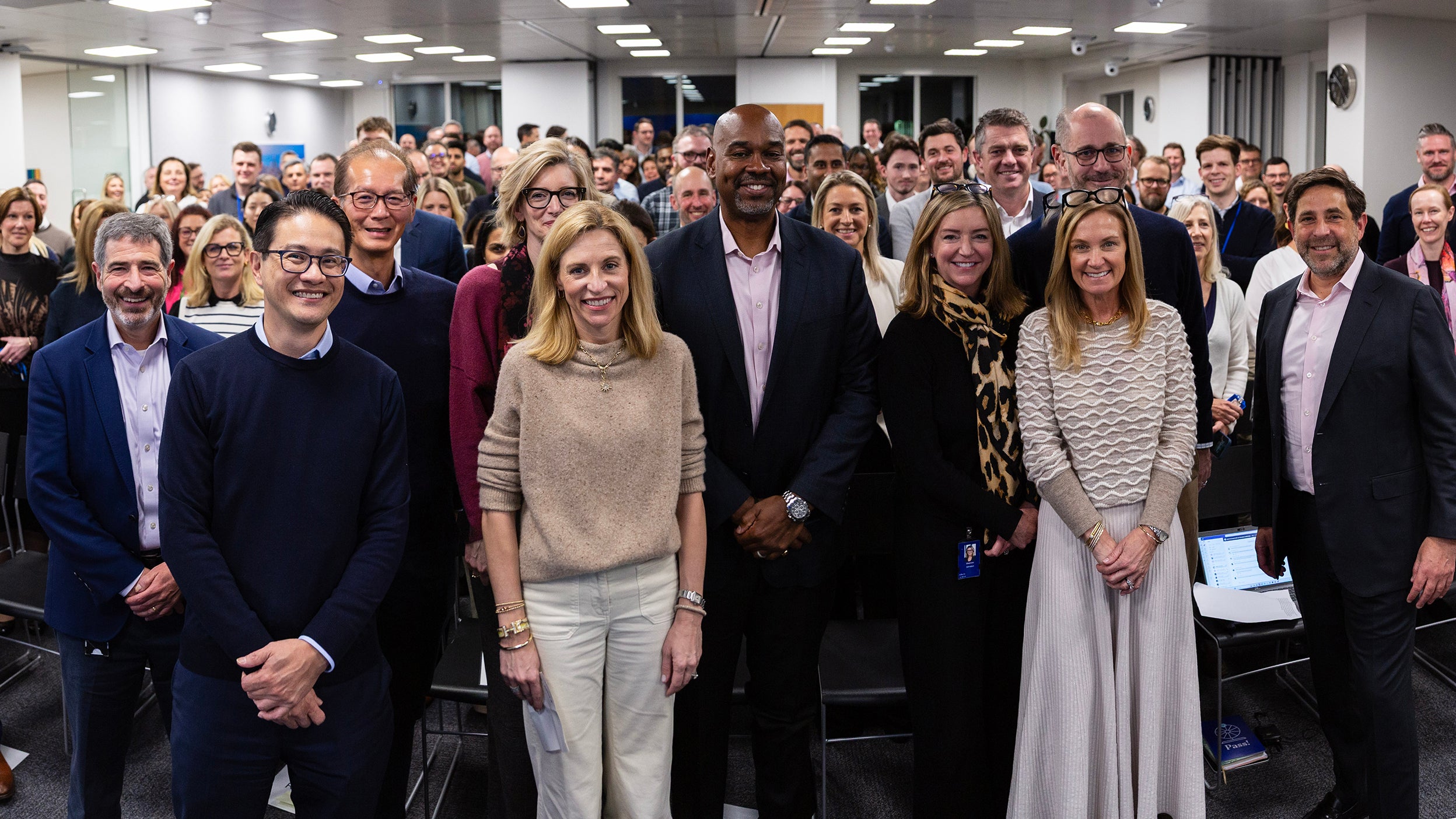 Employees standing in UK office
