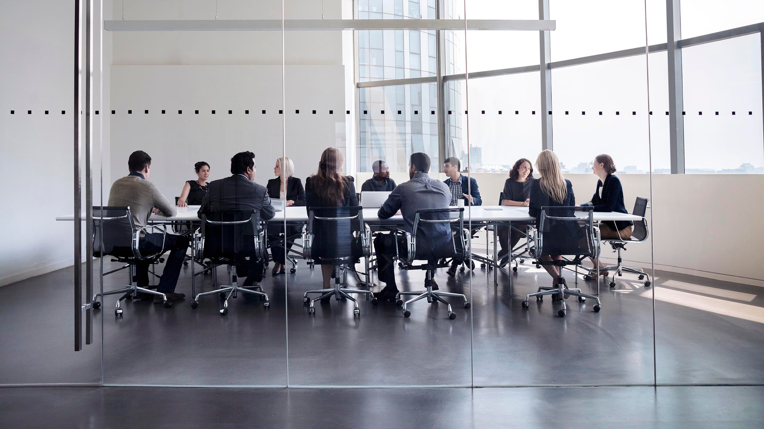 executives sitting in conferance room