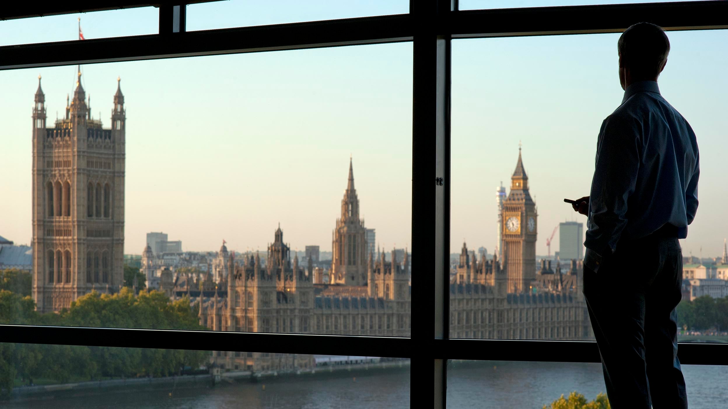 man watching through window