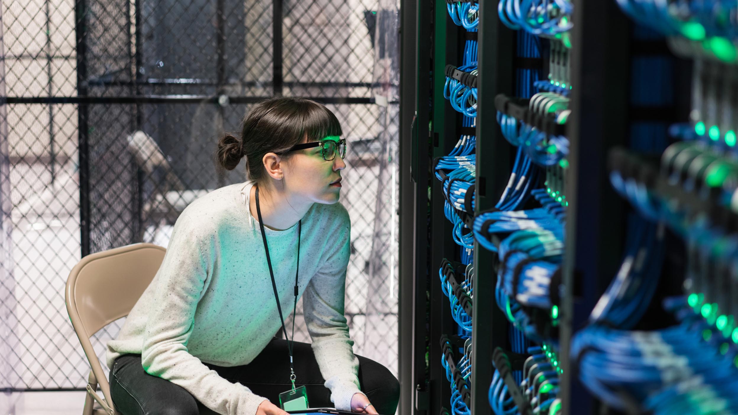 Woman looking at a IT database server