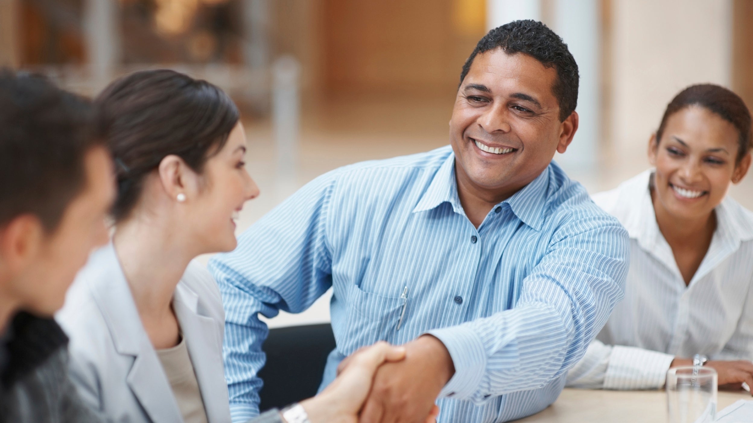 Business executives handshaking after striking a business deal