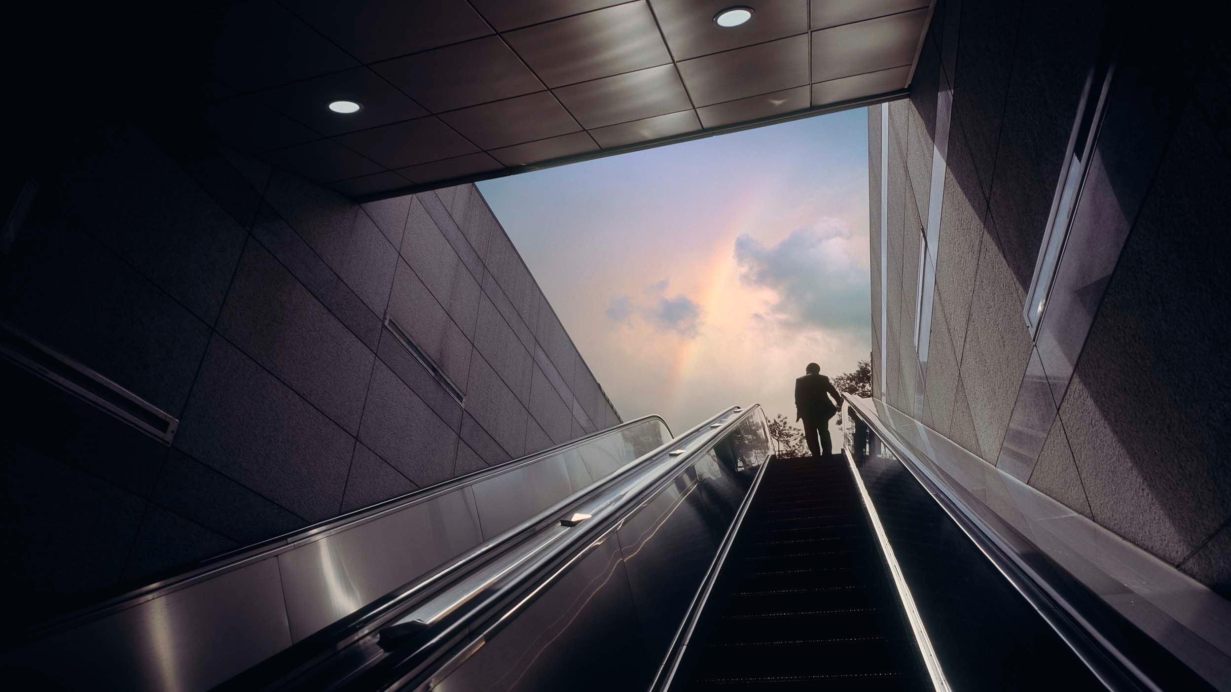 Man taking an escalator