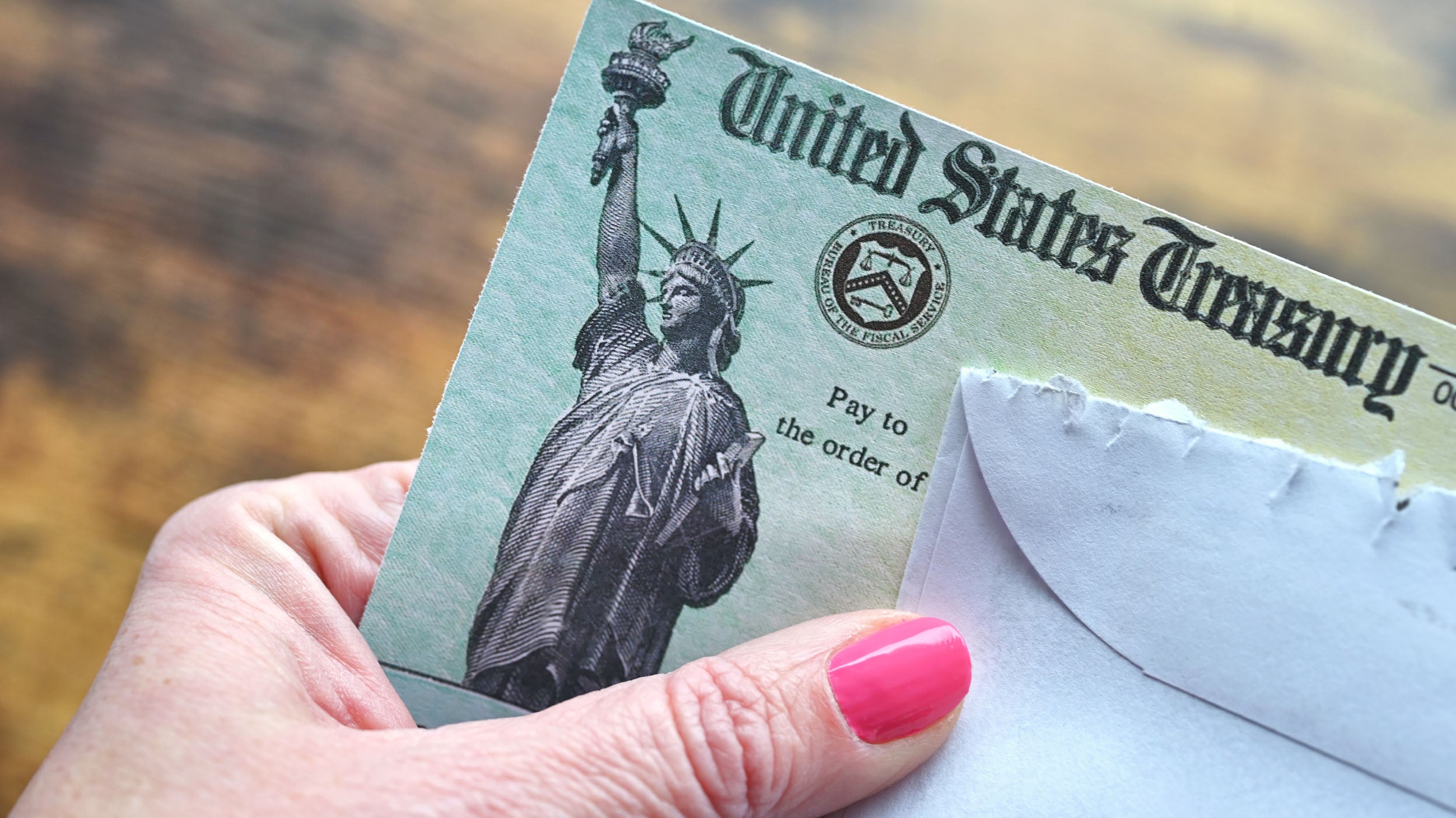 U.S. Treasury check in envelope.