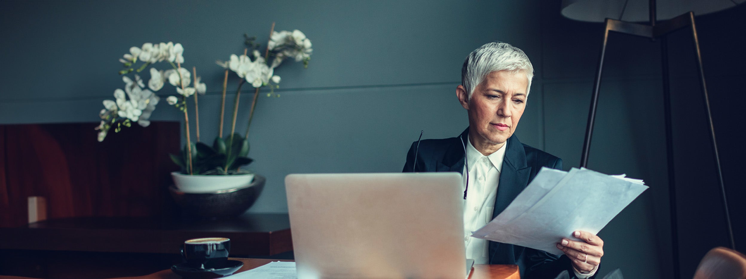 An employeers looking at papers in office