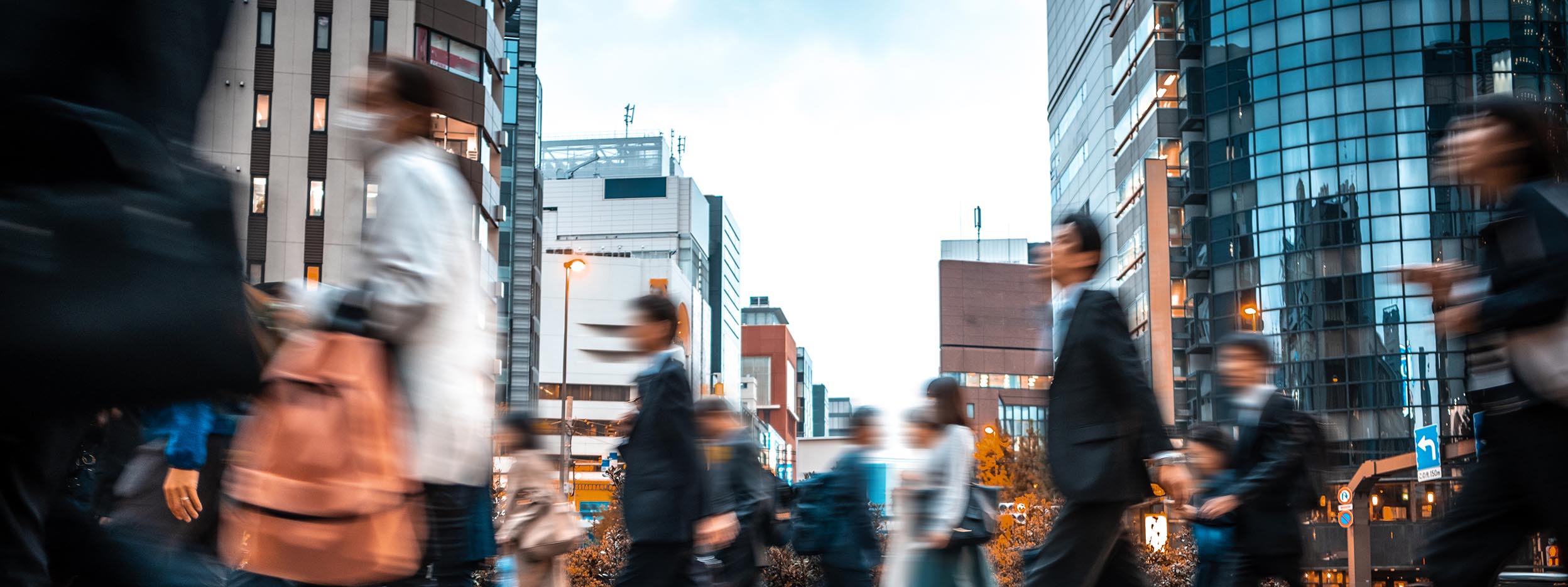 people walking through busy city street