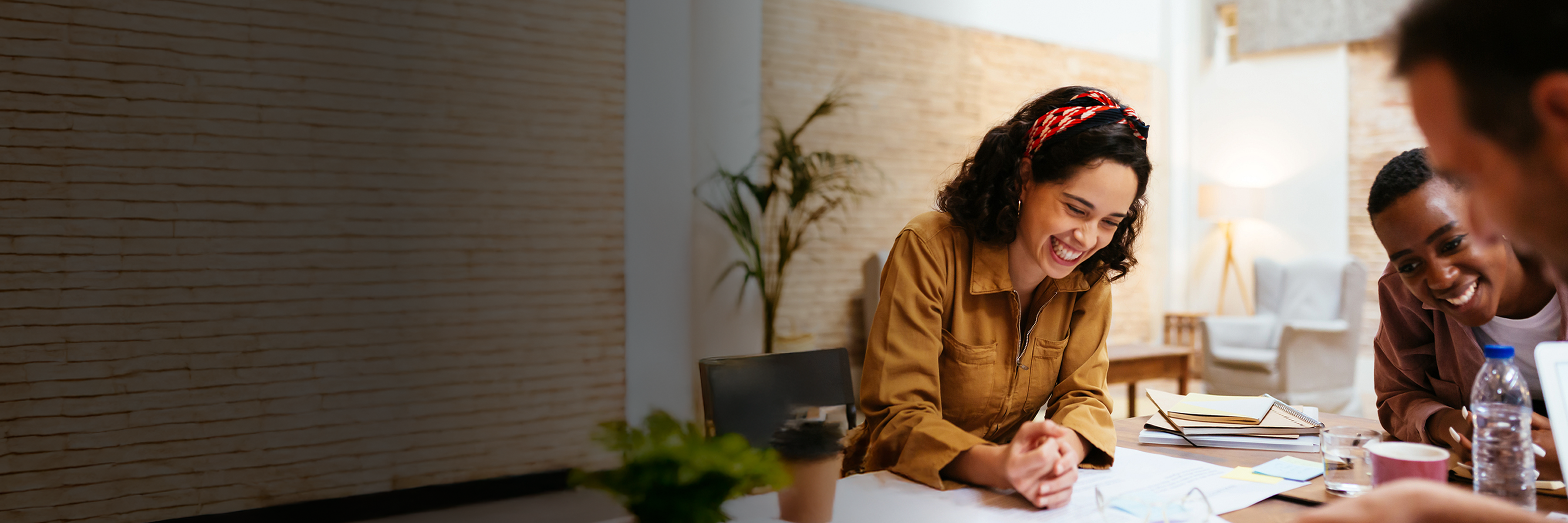 People smiling looking at paper
