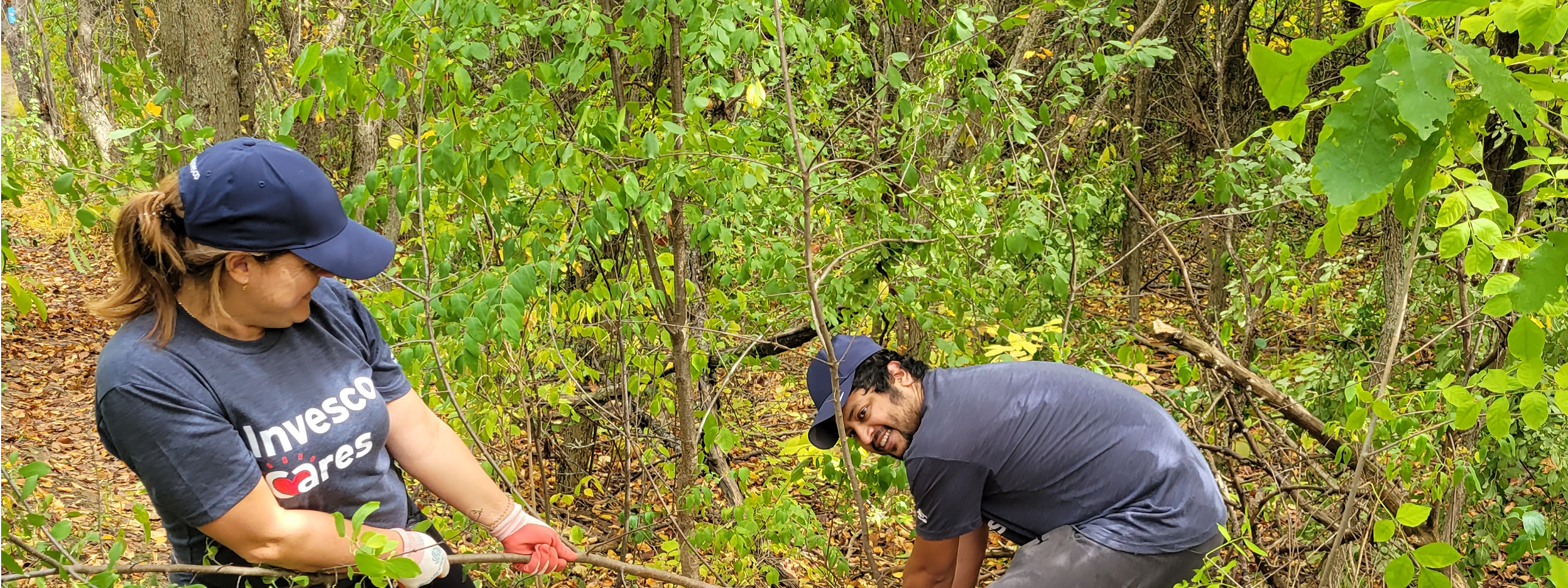 Invesco Cares employees doing cleanup