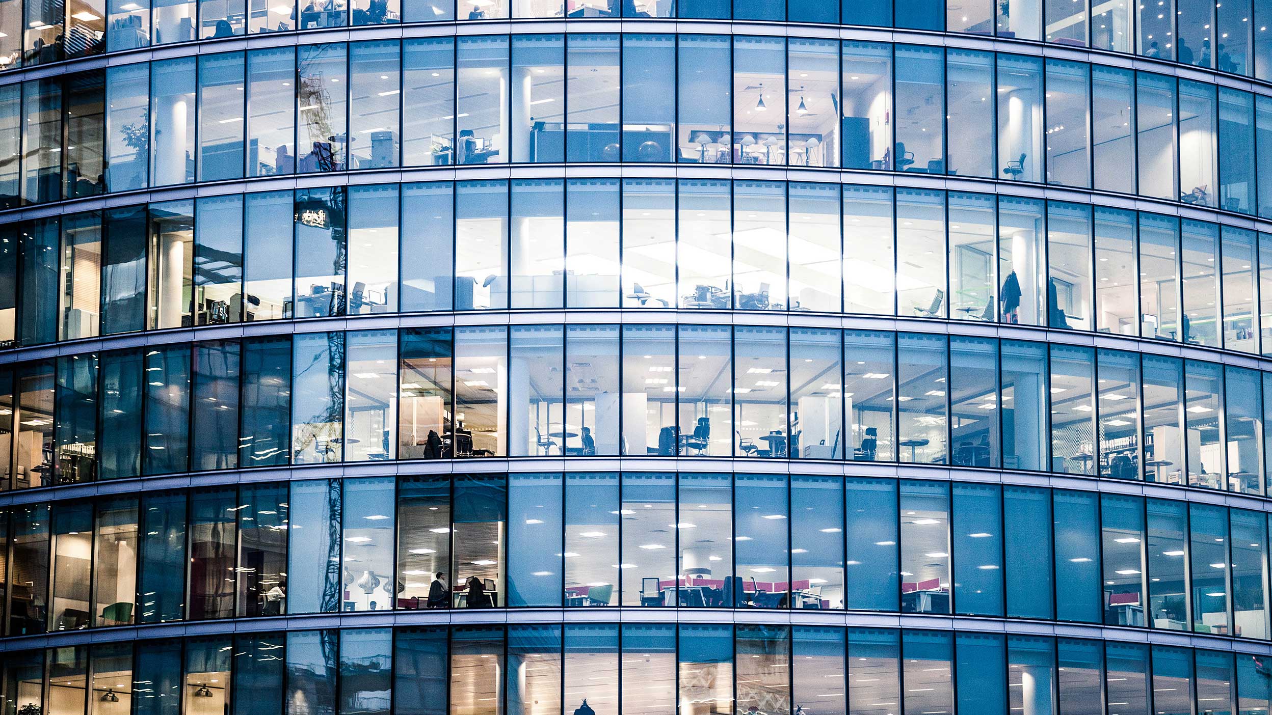 Modern office building representing official institutions and long-term investment partnerships