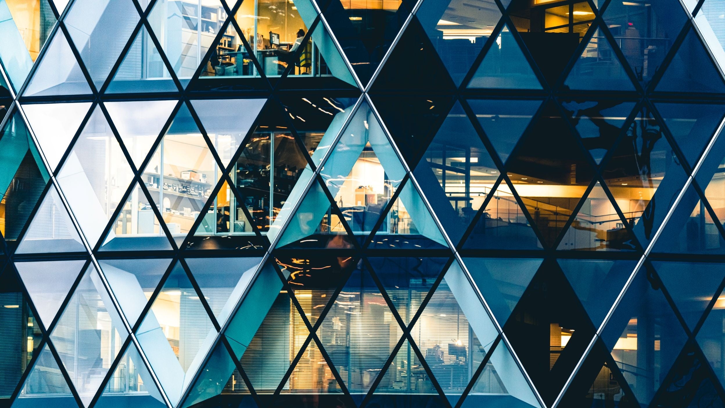 Close up of the windows of the Gherkin building in the City of London financial district.