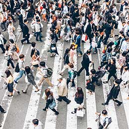 Pedestrians%20crossing%20street%20on%20walkway%20in%20Japan.%20High%20angle%20view.