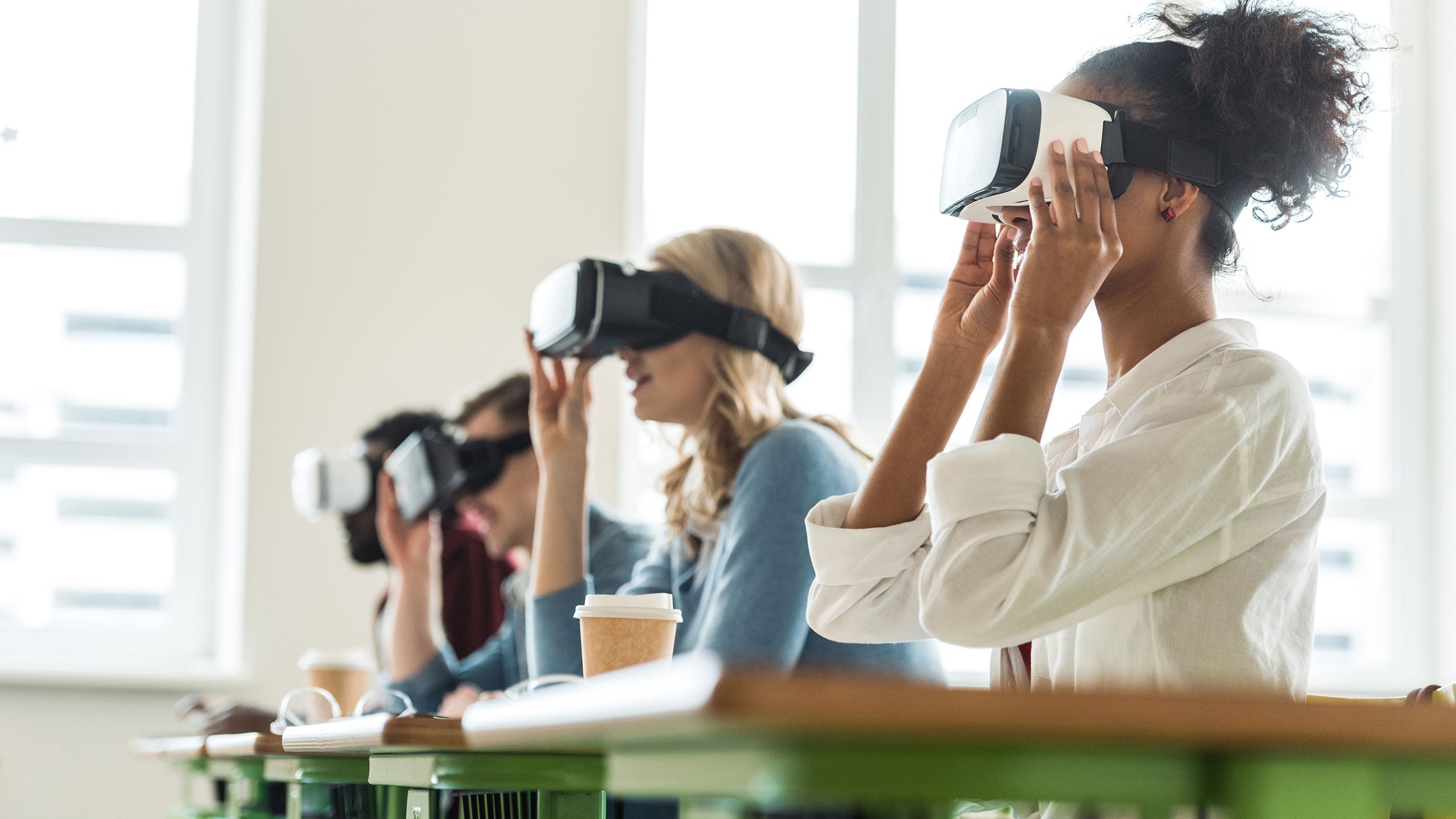 Women looking through VR headsets
