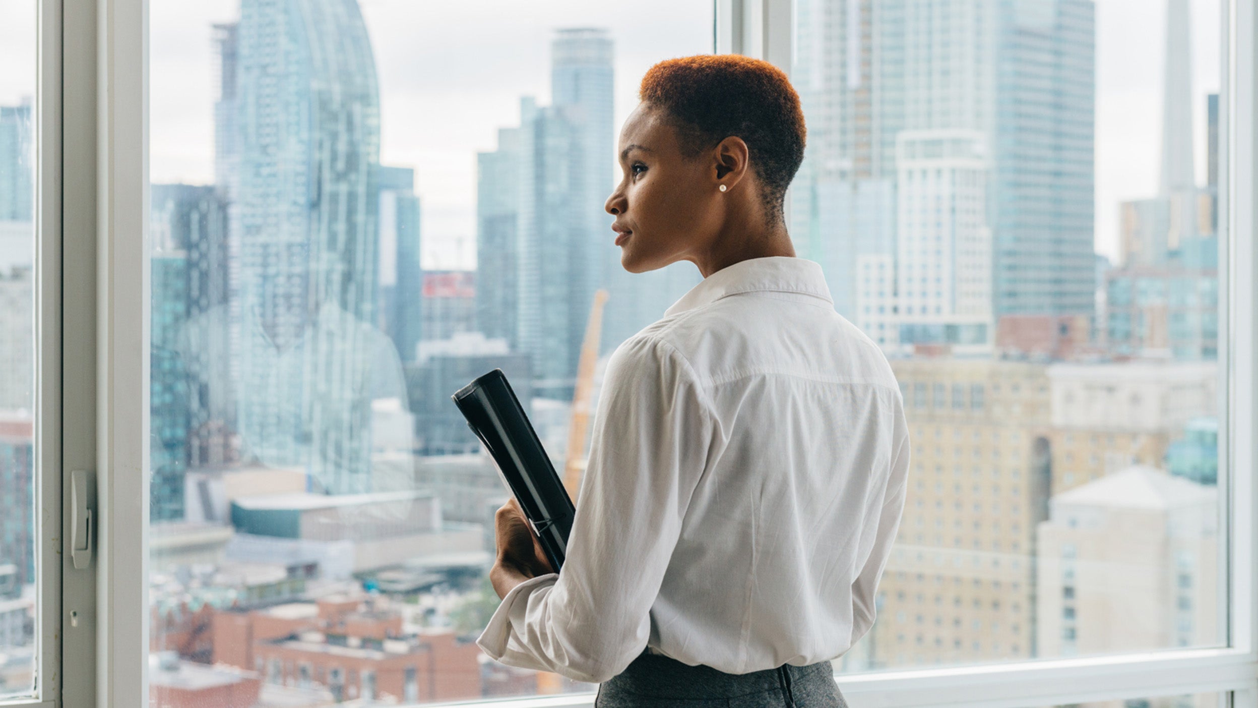 Business woman looking out the window