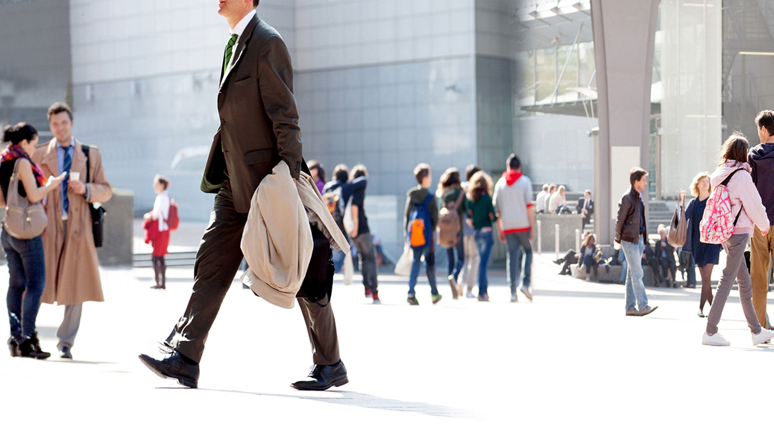 People walking against a light background