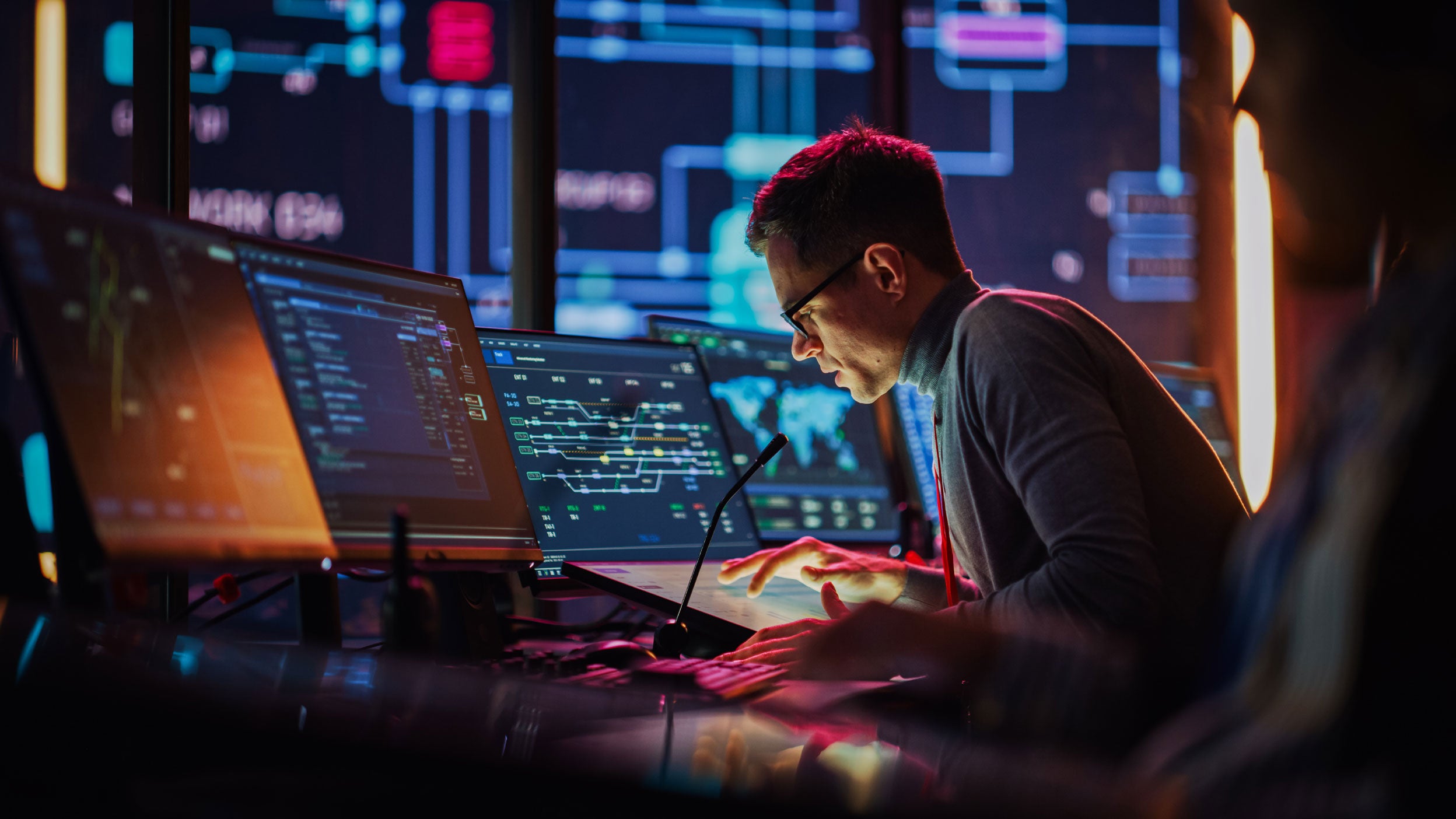 Professional overseeing digital infrastructure and data-driven technology systems.