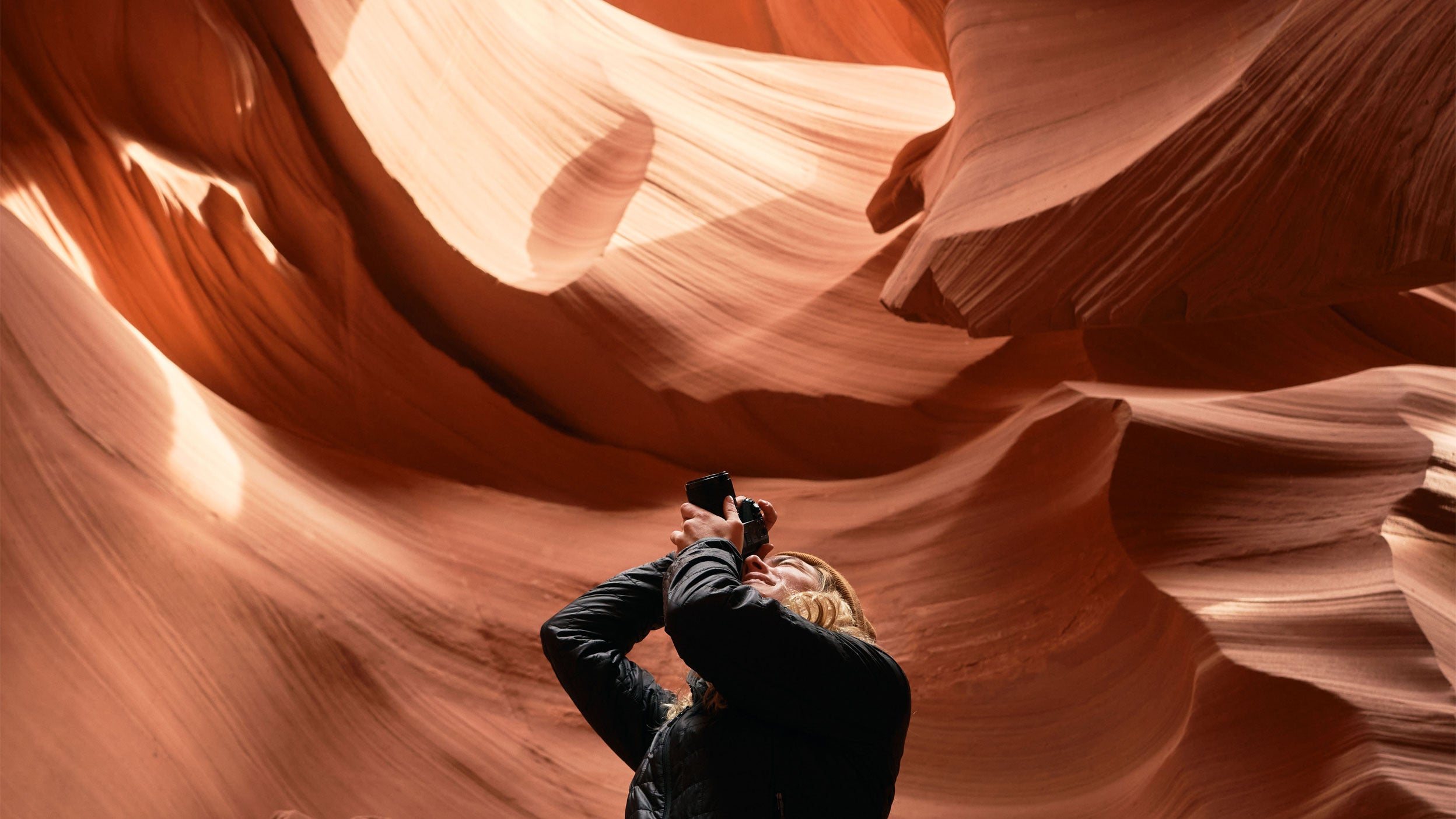 Photographer exploring Antelope National park canyon. Travel US concept