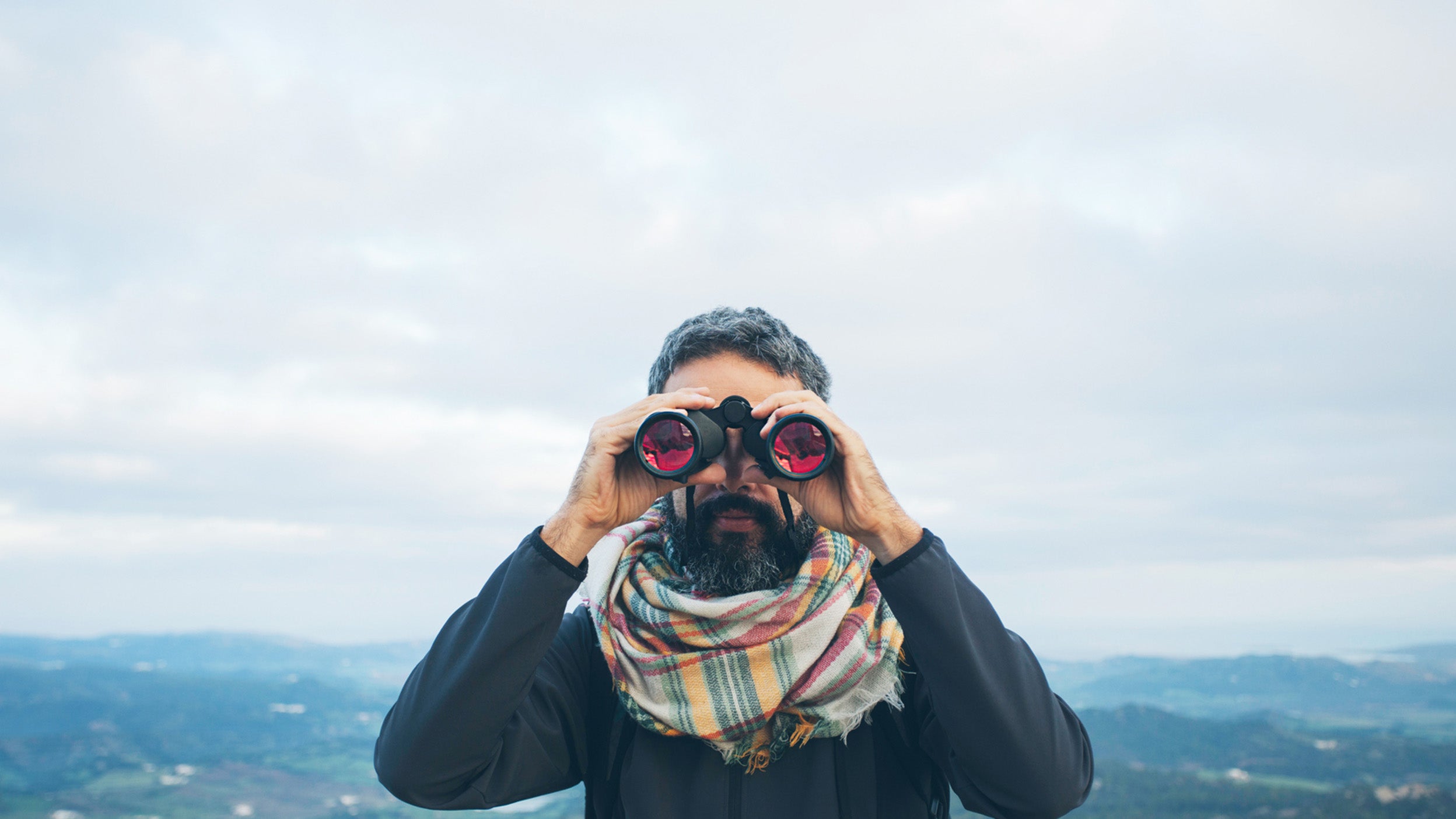 Man using binoculars.