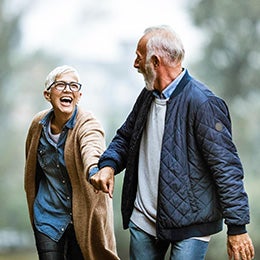 Cheerful%20senior%20couple%20having%20fun%20in%20the%20park.%20Focus%20is%20on%20woman.