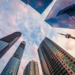 The%20landmark%20of%20Toronto%20CN%20Tower%20rising%20straight%20up%20alongside%20compact%20corporate%20skyscrapers%20in%20sunrise.