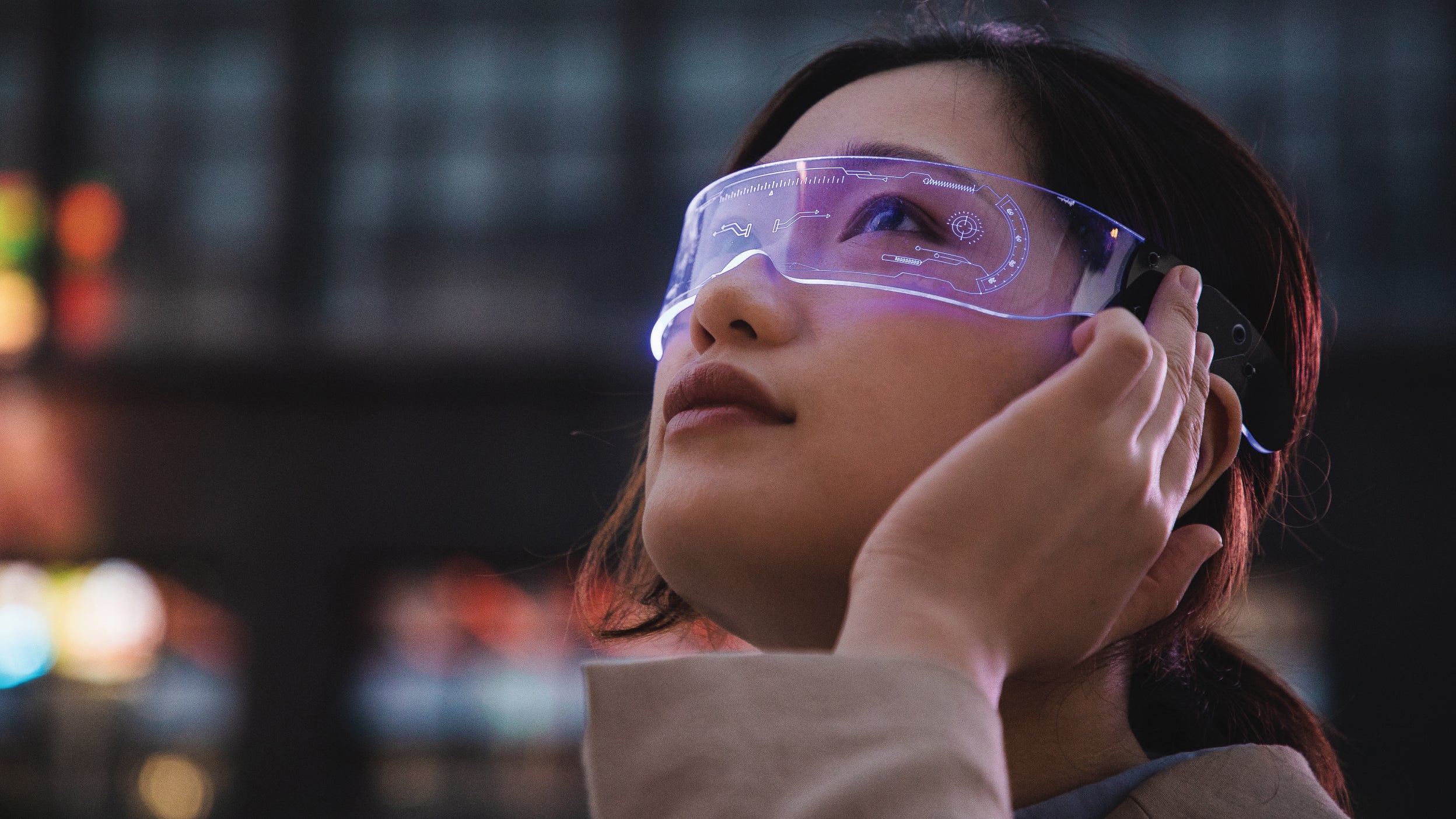asian woman using a smart glasses in front of an office building (the glassed used in the shot is a generic product in China)