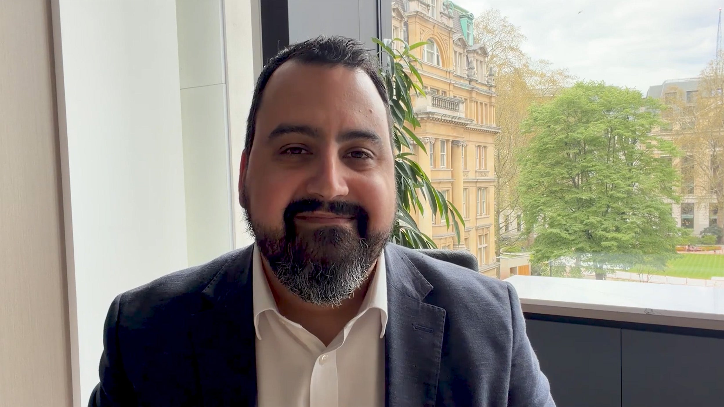 scrrenshot of David Aujla talking in the video