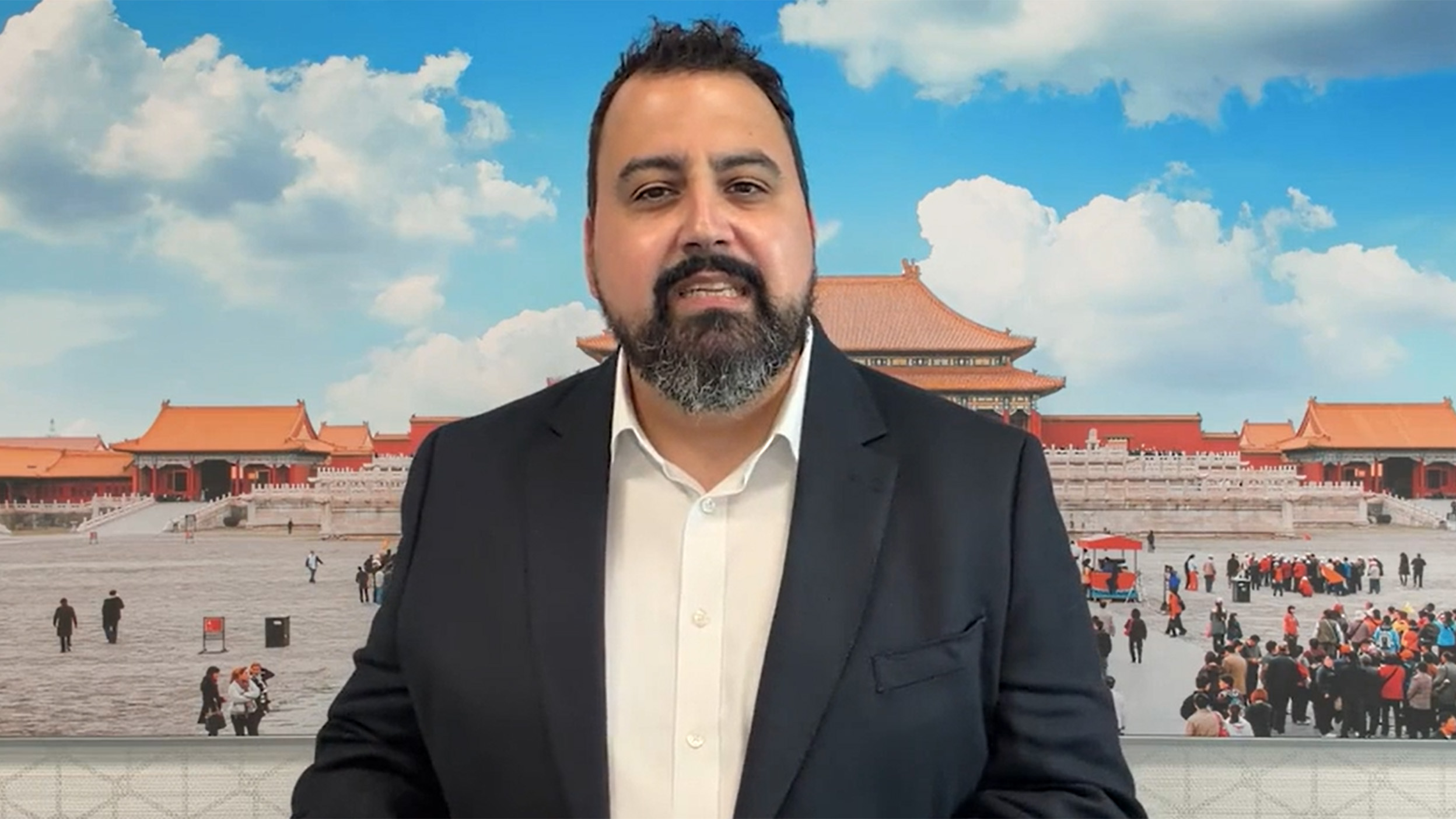 scrrenshot of David Aujla talking in the video