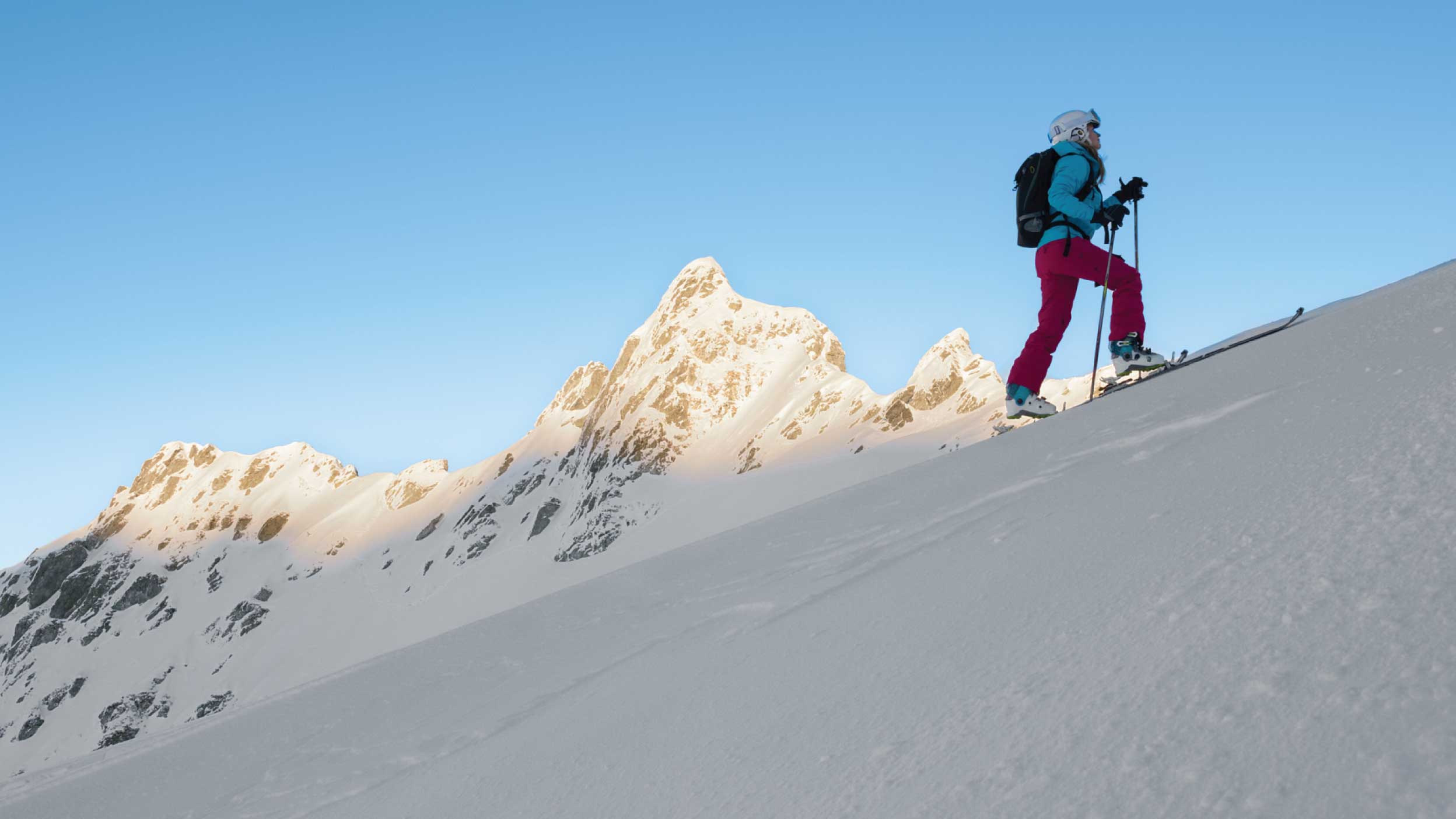 woman climing up an ice mountain