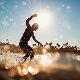 Male%20surfer%20riding%20wave%20on%20sunny%20summer%20ocean