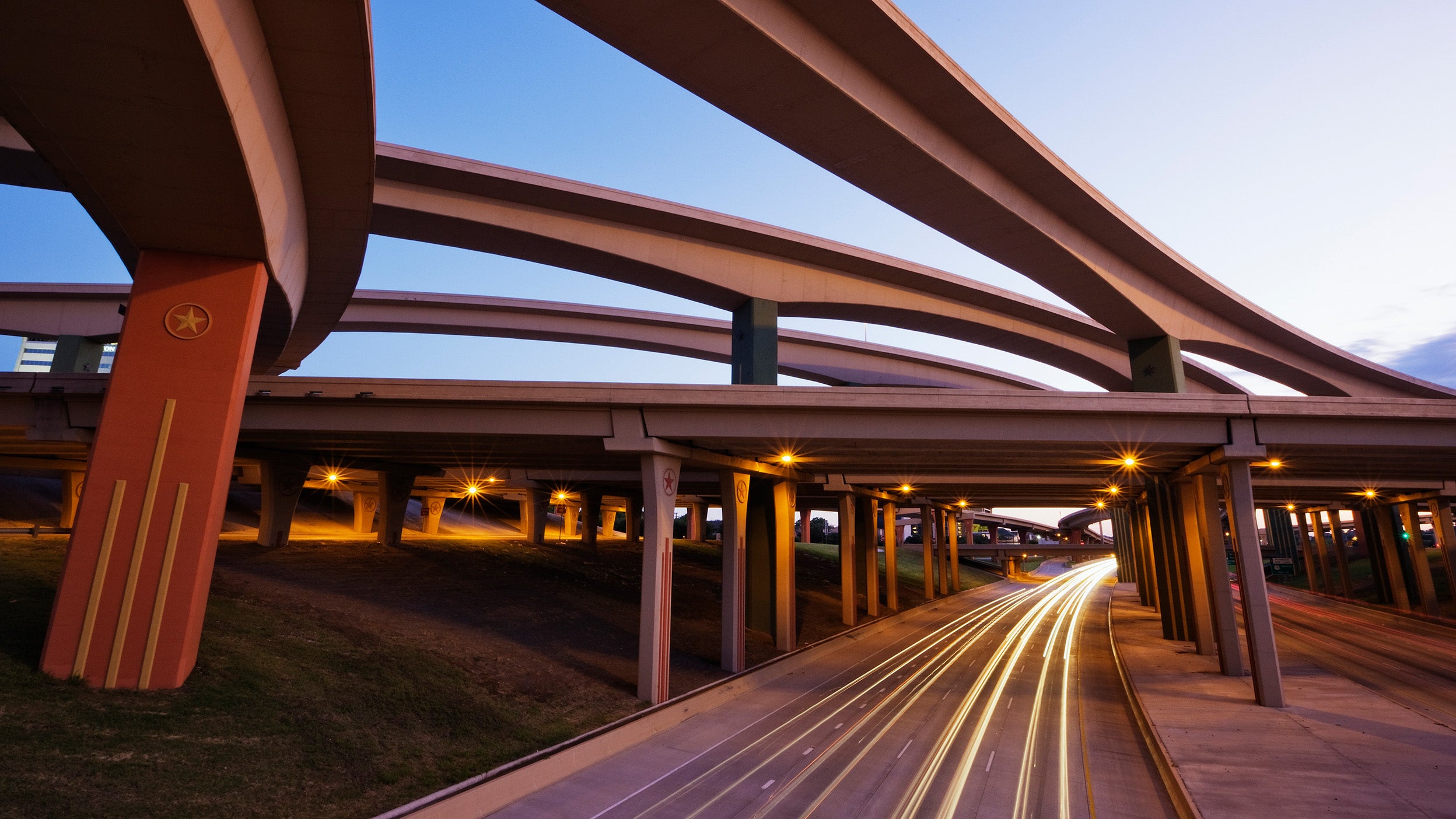 Blurred motion view of traffic driving on highway underpass