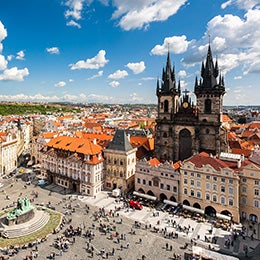Aerial%20view%20of%20Prague%27s%20Old%20Town%20Square%20with%20colourful%20historic%20buildings,%20a%20central%20statue,%20and%20the%20Church%20of%20Our%20Lady%20before%20Týn%20under%20a%20partly%20cloudy%20sky.