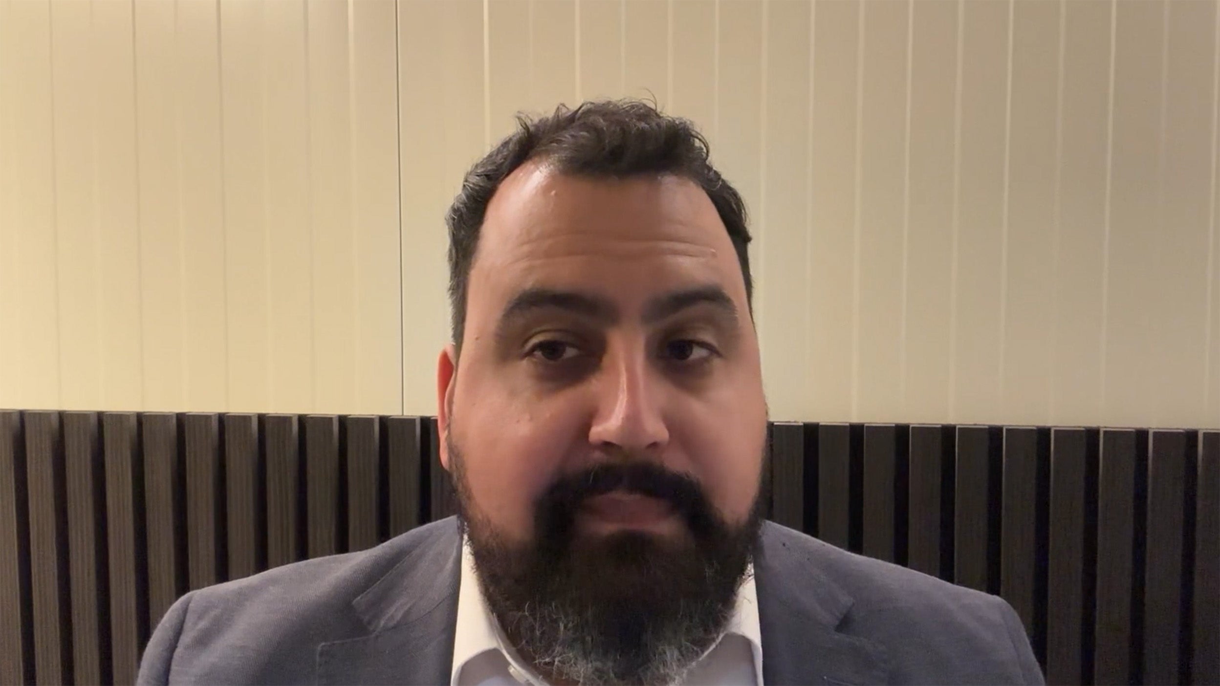 scrrenshot of David Aujla talking in the video