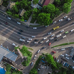 Aerial%20top%20view%20of%20road%20junction%20from%20above,%20automobile%20traffic%20and%20jam%20of%20many%20cars.