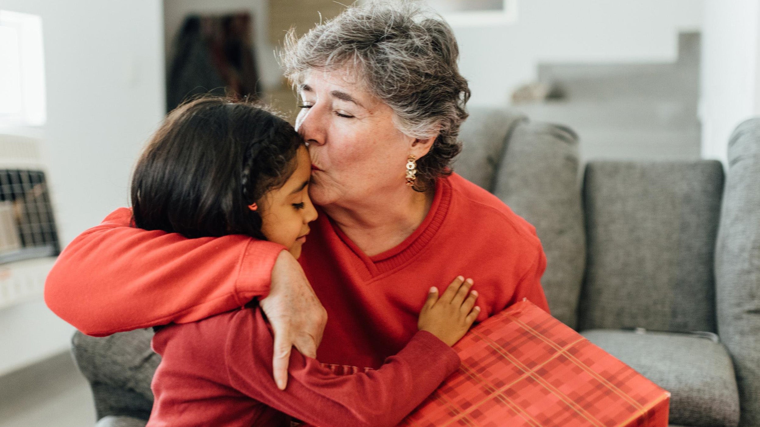 Mexican family opening presents on Christmas morning
