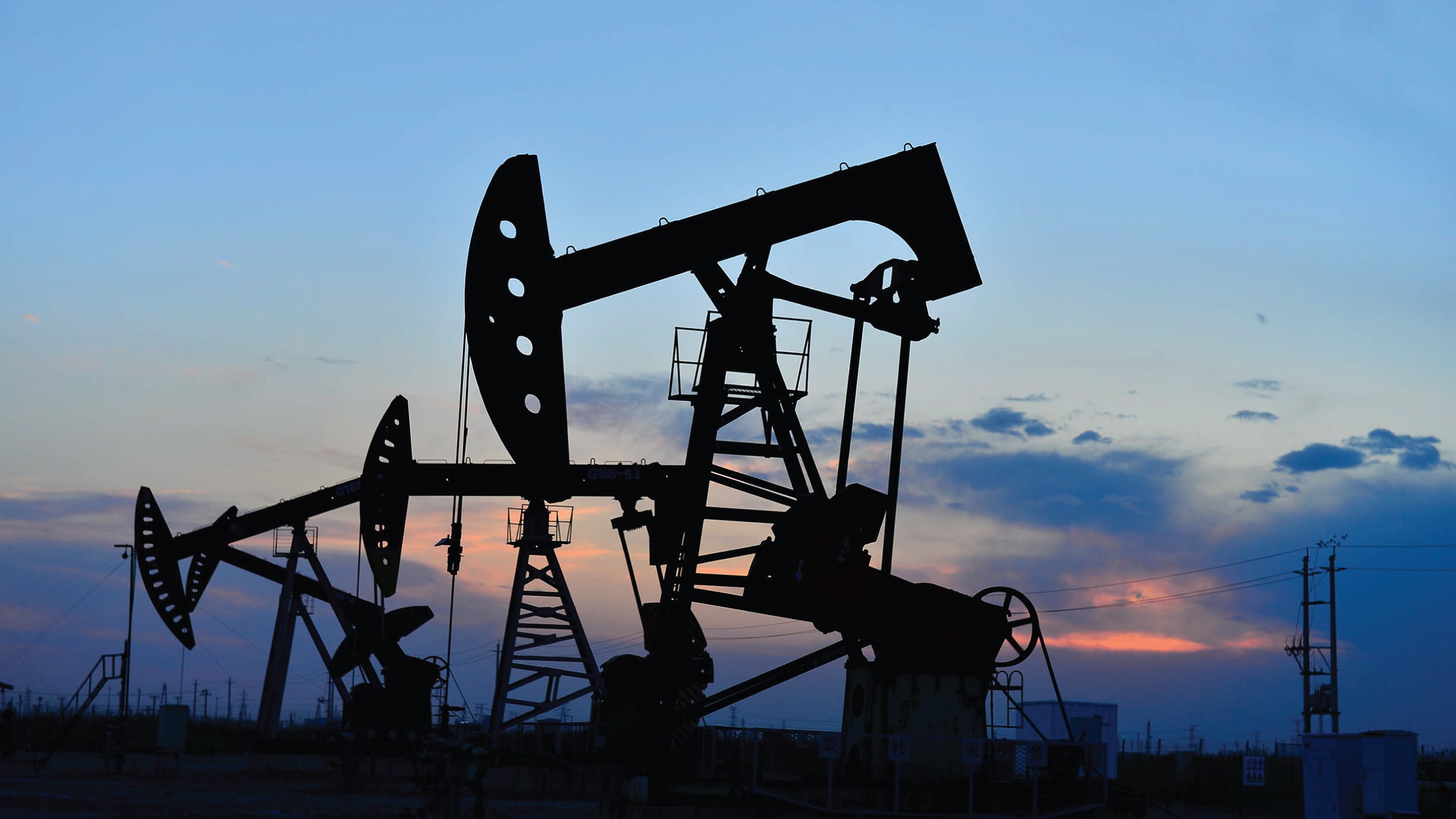 Oils rigs at sunset.