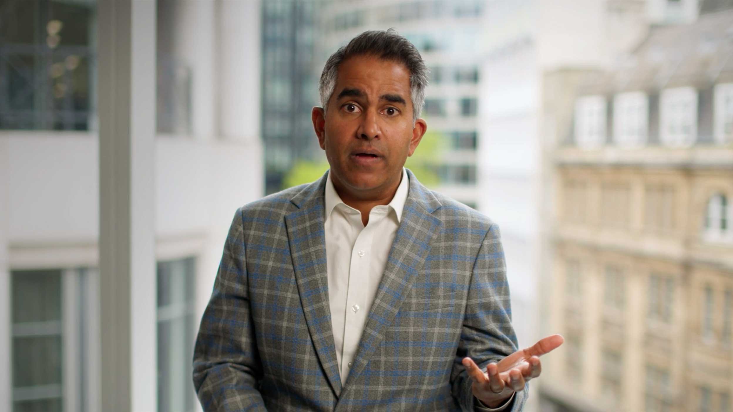 Screenshot of Raman Rajagopal talking in the video