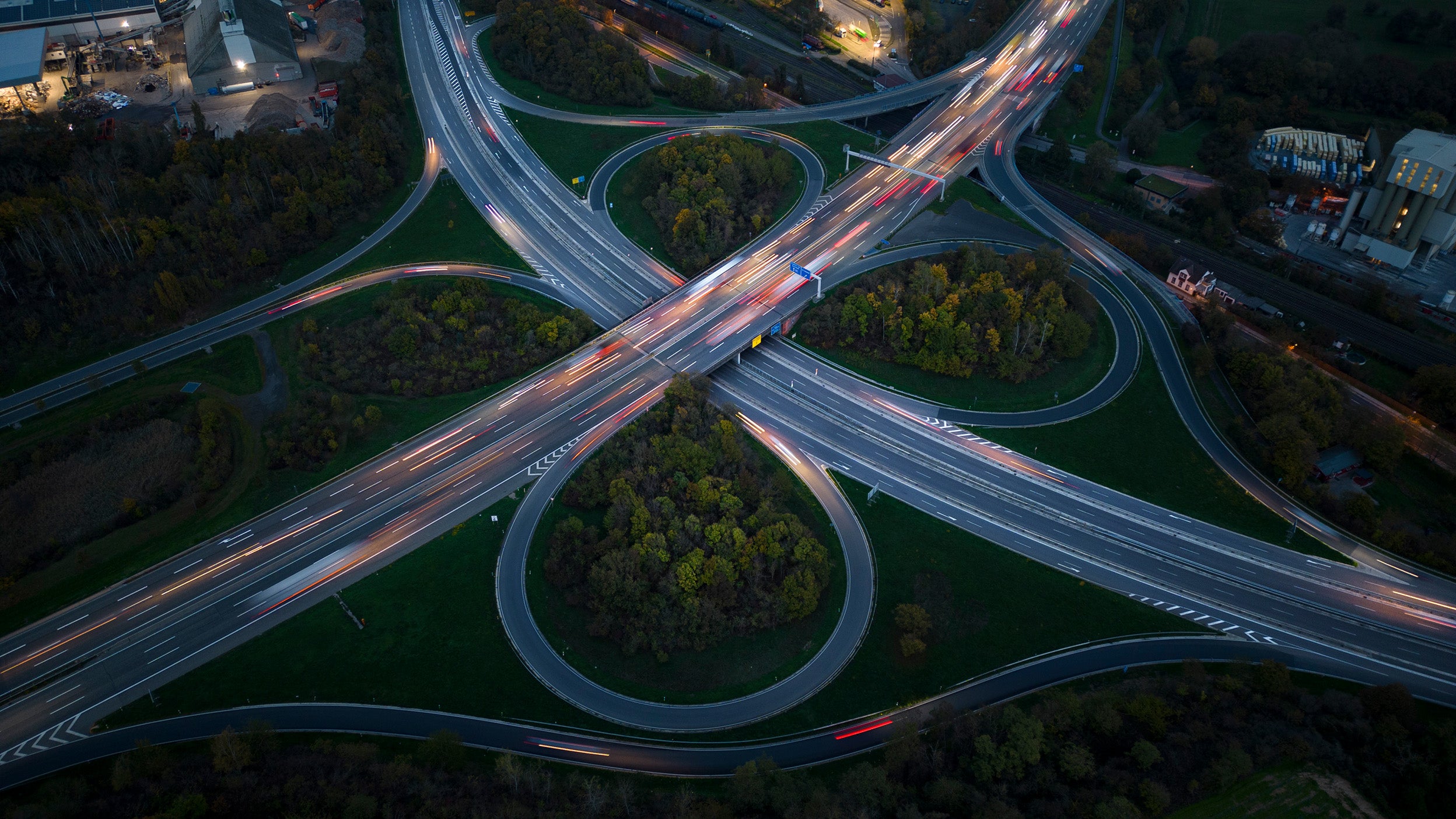 Highway interchange at dusk - aerial view
