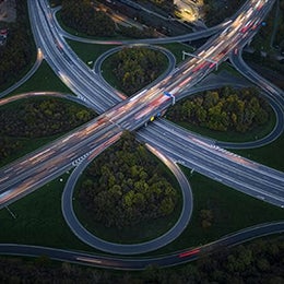 Highway interchange at dusk - aerial view