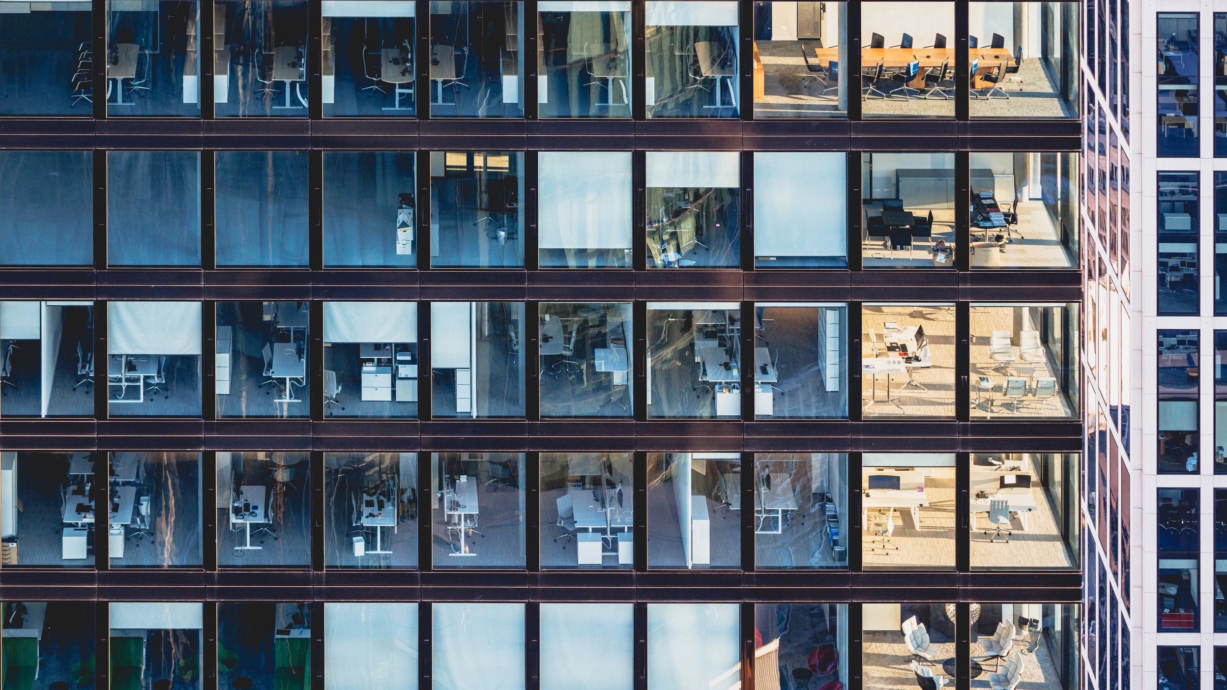 Corporate building facade in office windows made of glass and steel frame in Frankfurt