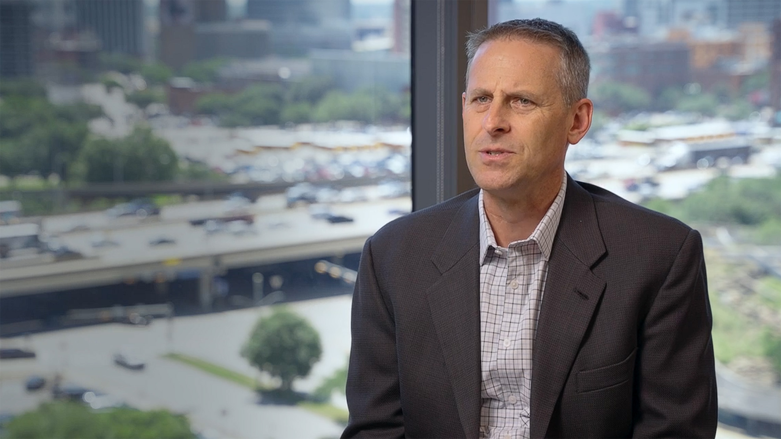 Dan Kubiak, Managing Director Invesco Real Estate, talking to the camera. 