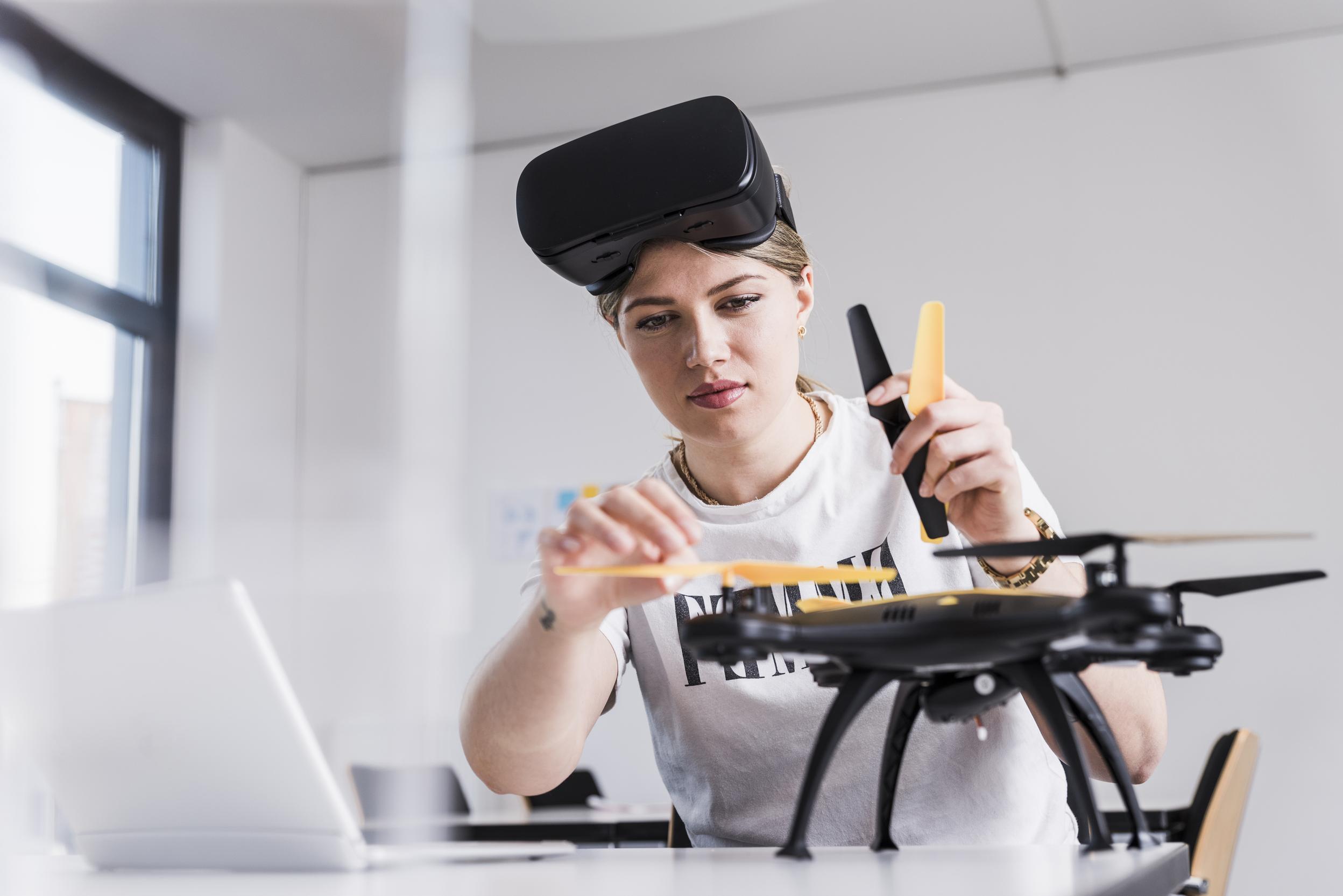 Woman fixing drone