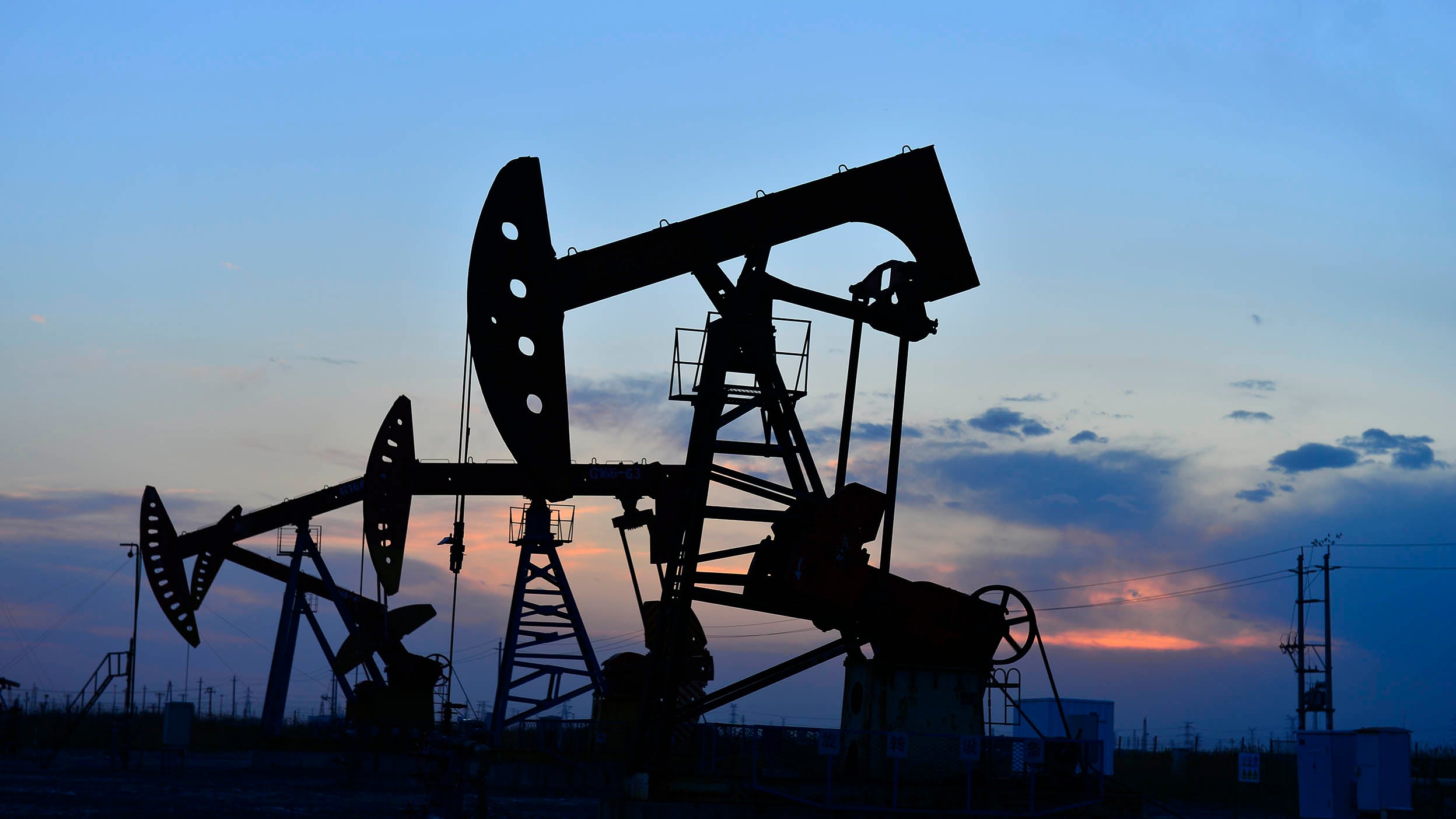 Oil rigs at sunset