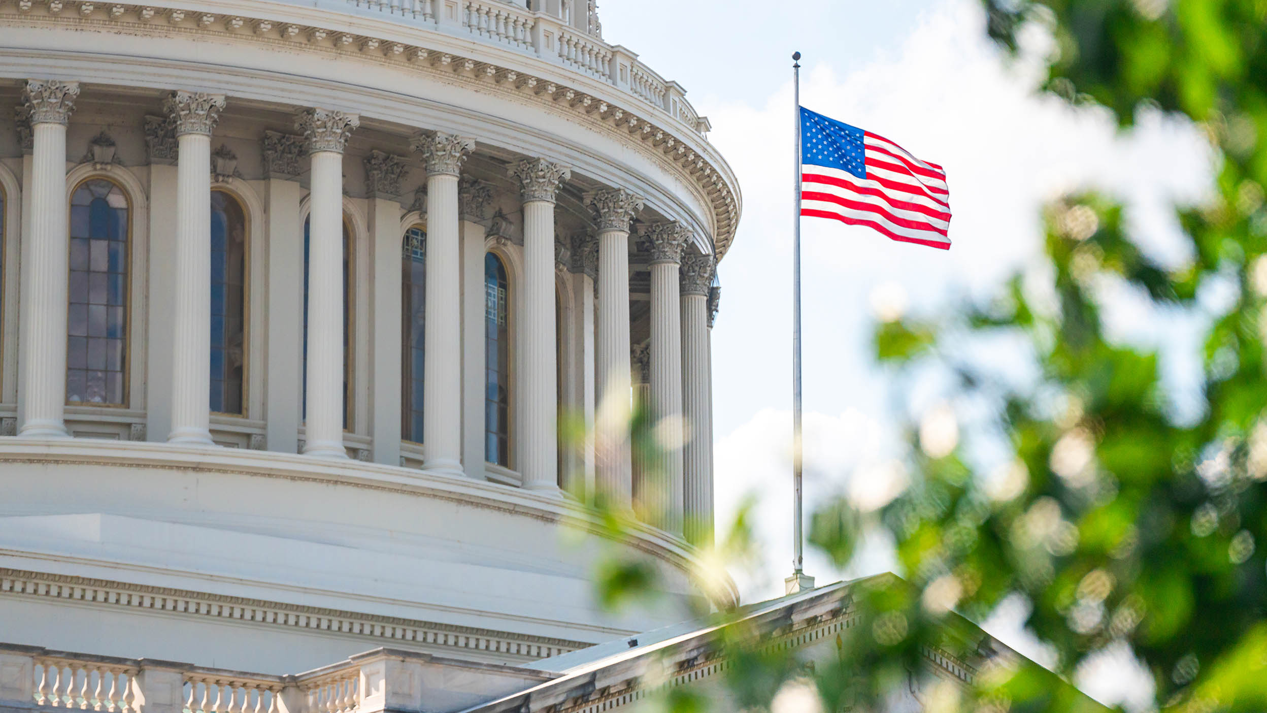 Close-up view of the American Flag on the US Capitol building in Washington D.C. on the East Façade