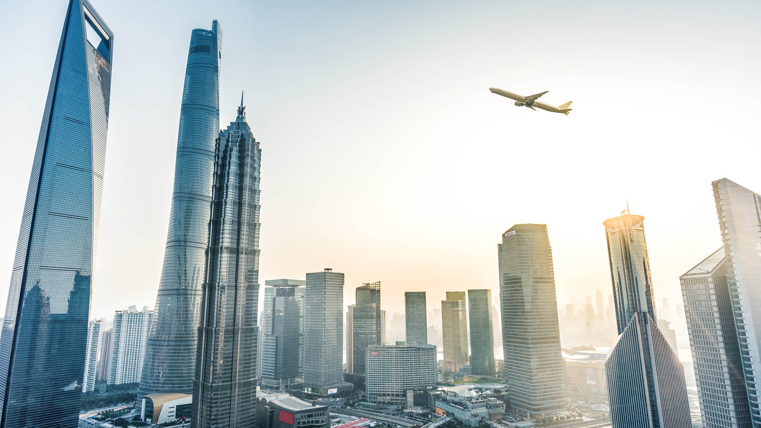 Plane flying over Shanghai