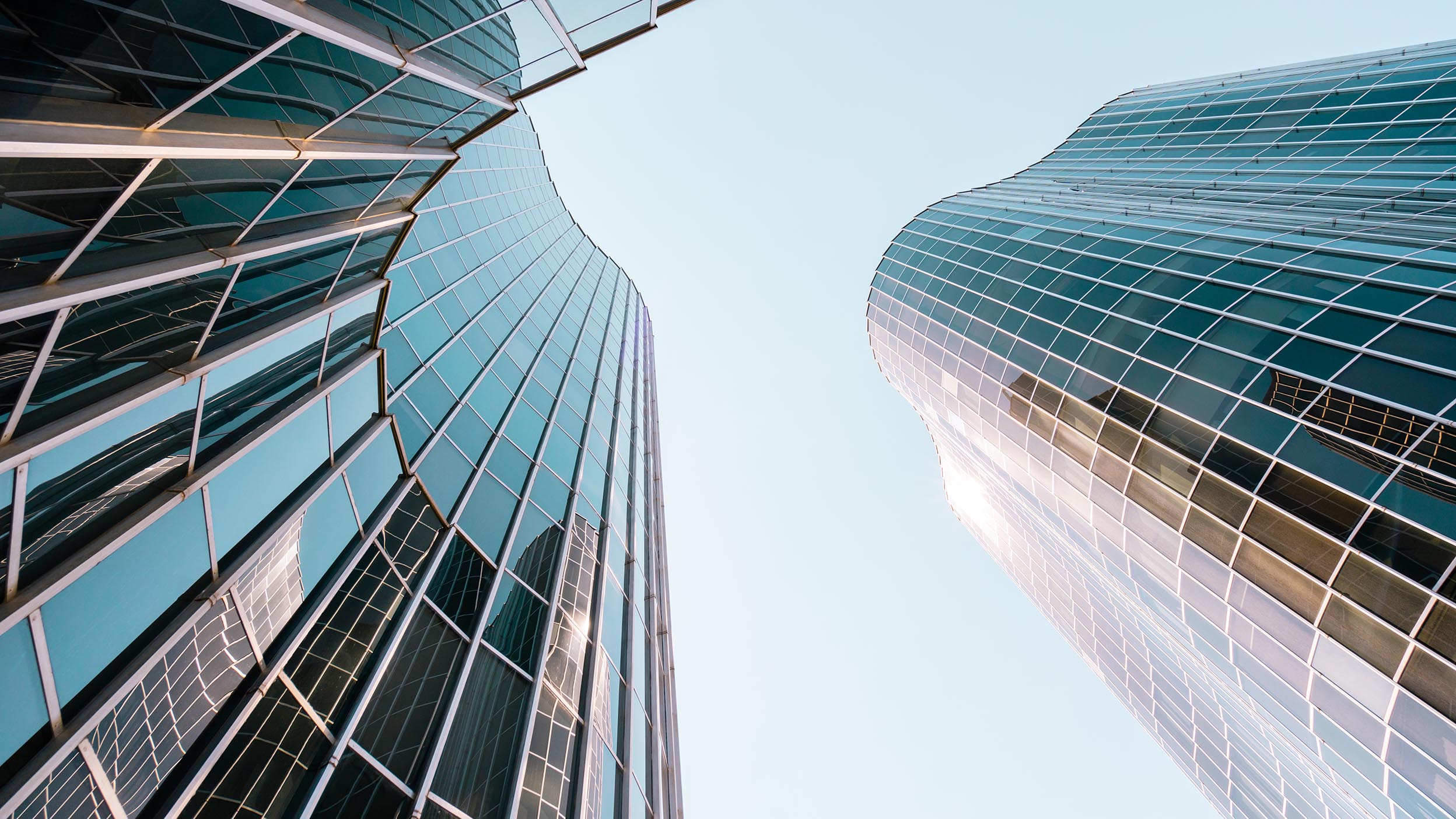 Point of view from below of a futuristic and curved building.